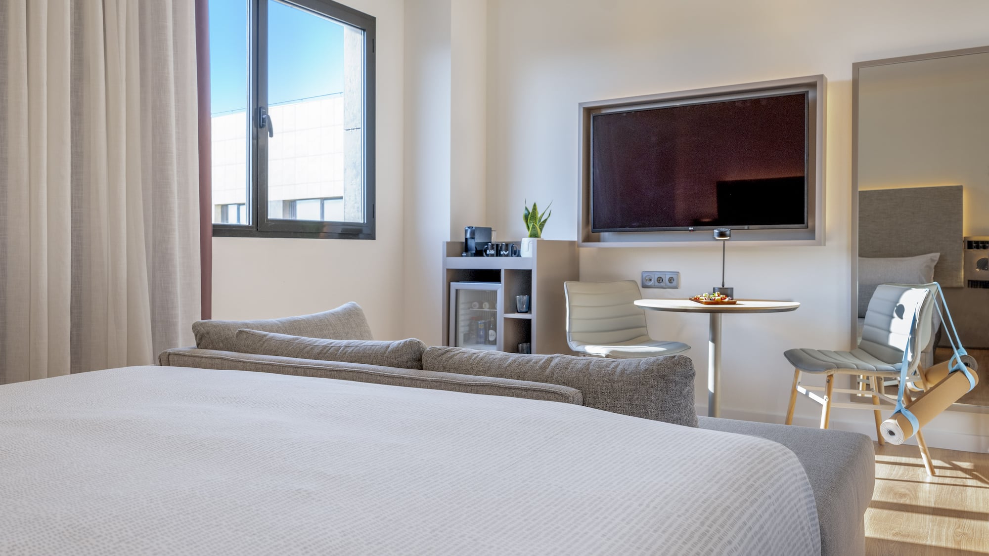 a room with a bed and a tv