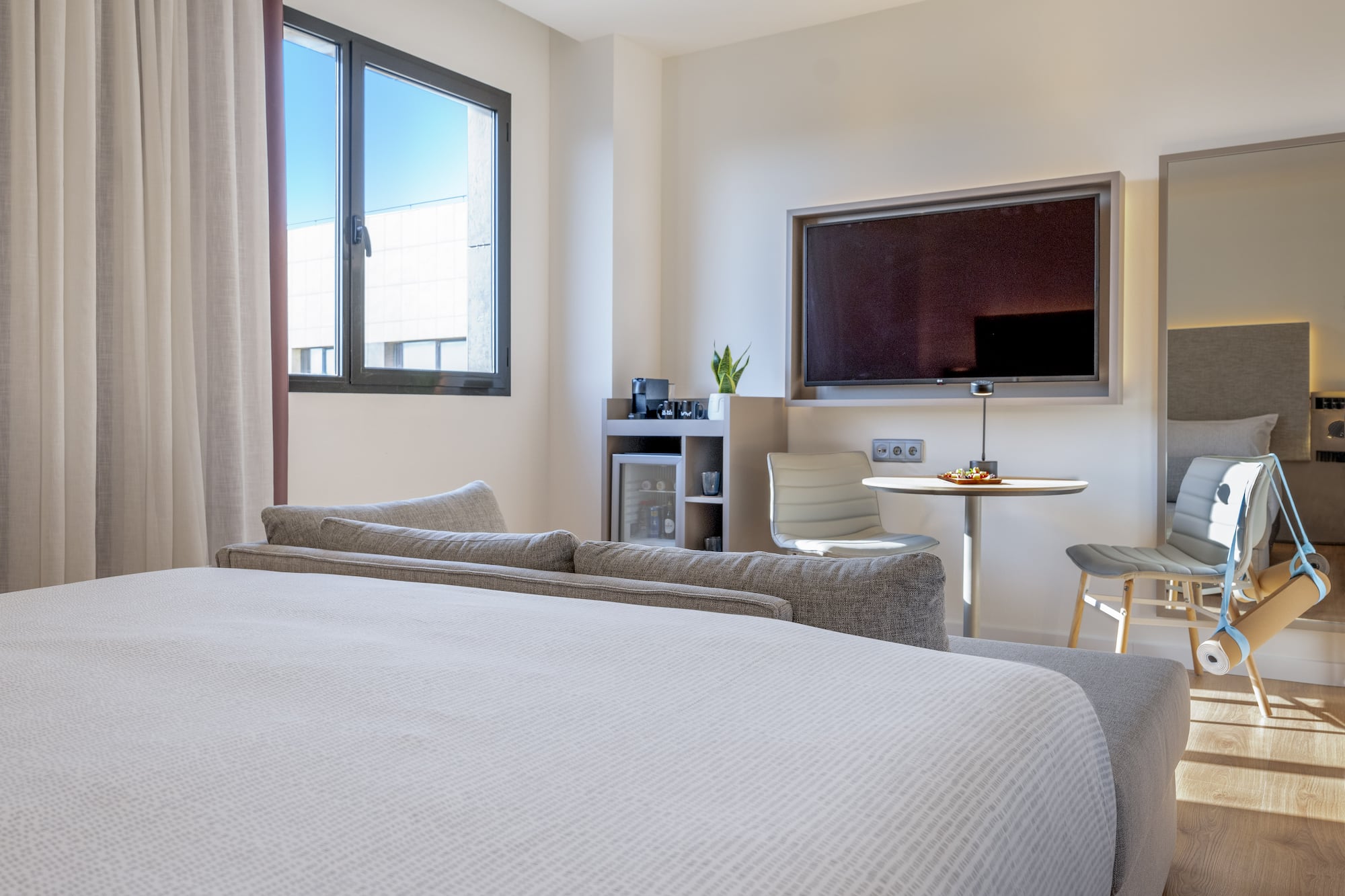 a room with a bed and a tv