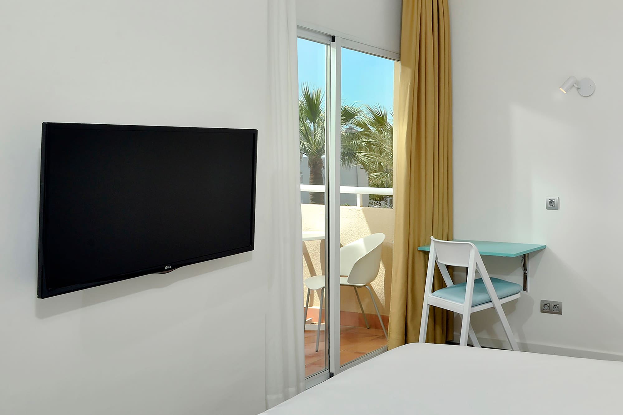 a room with a television on the wall