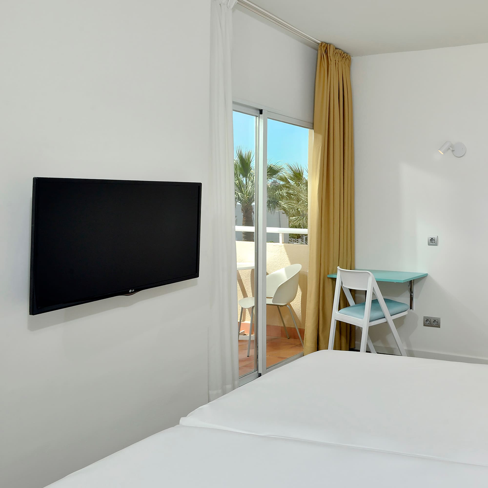 a room with a television on the wall