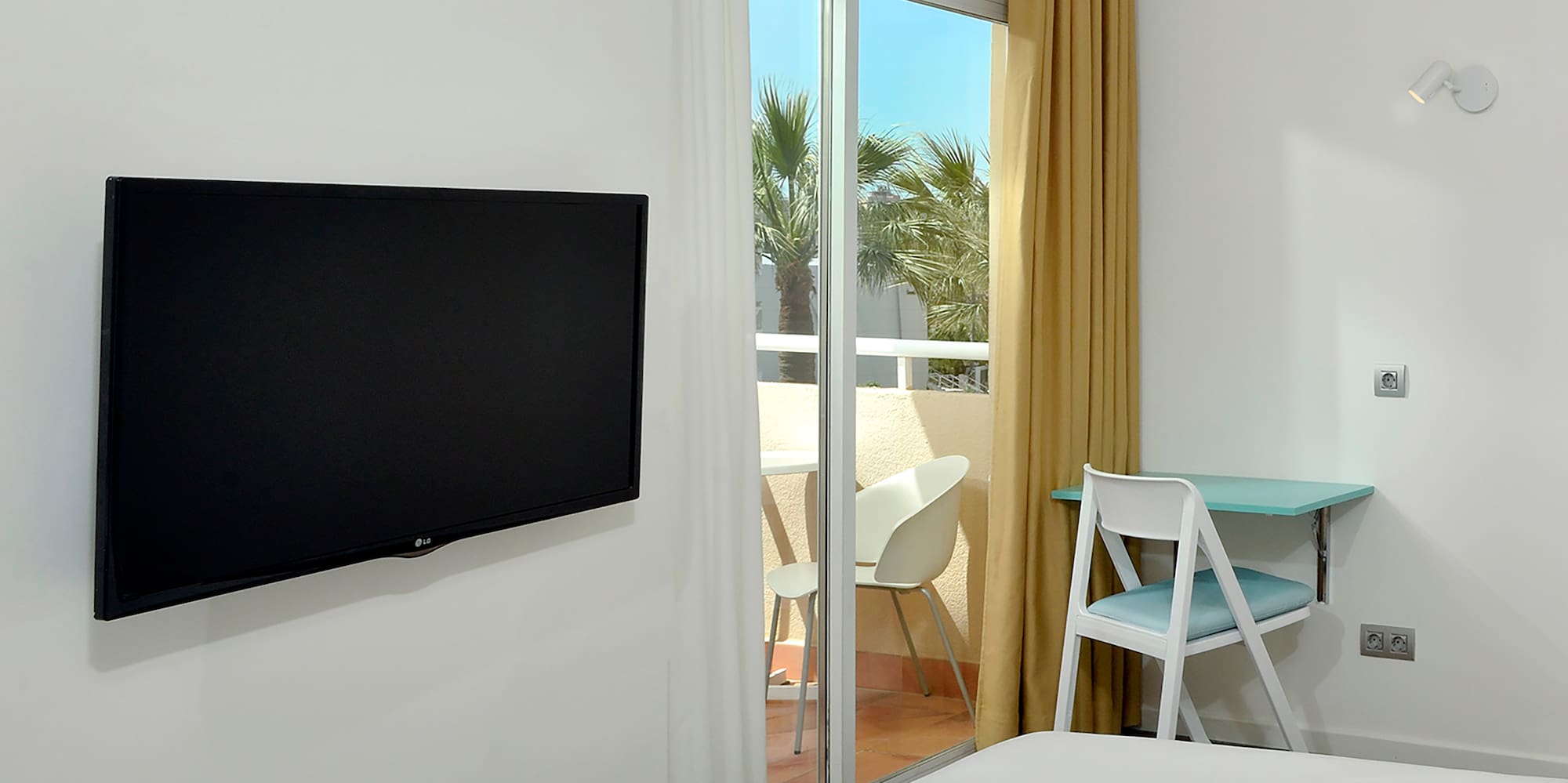 a room with a television on the wall