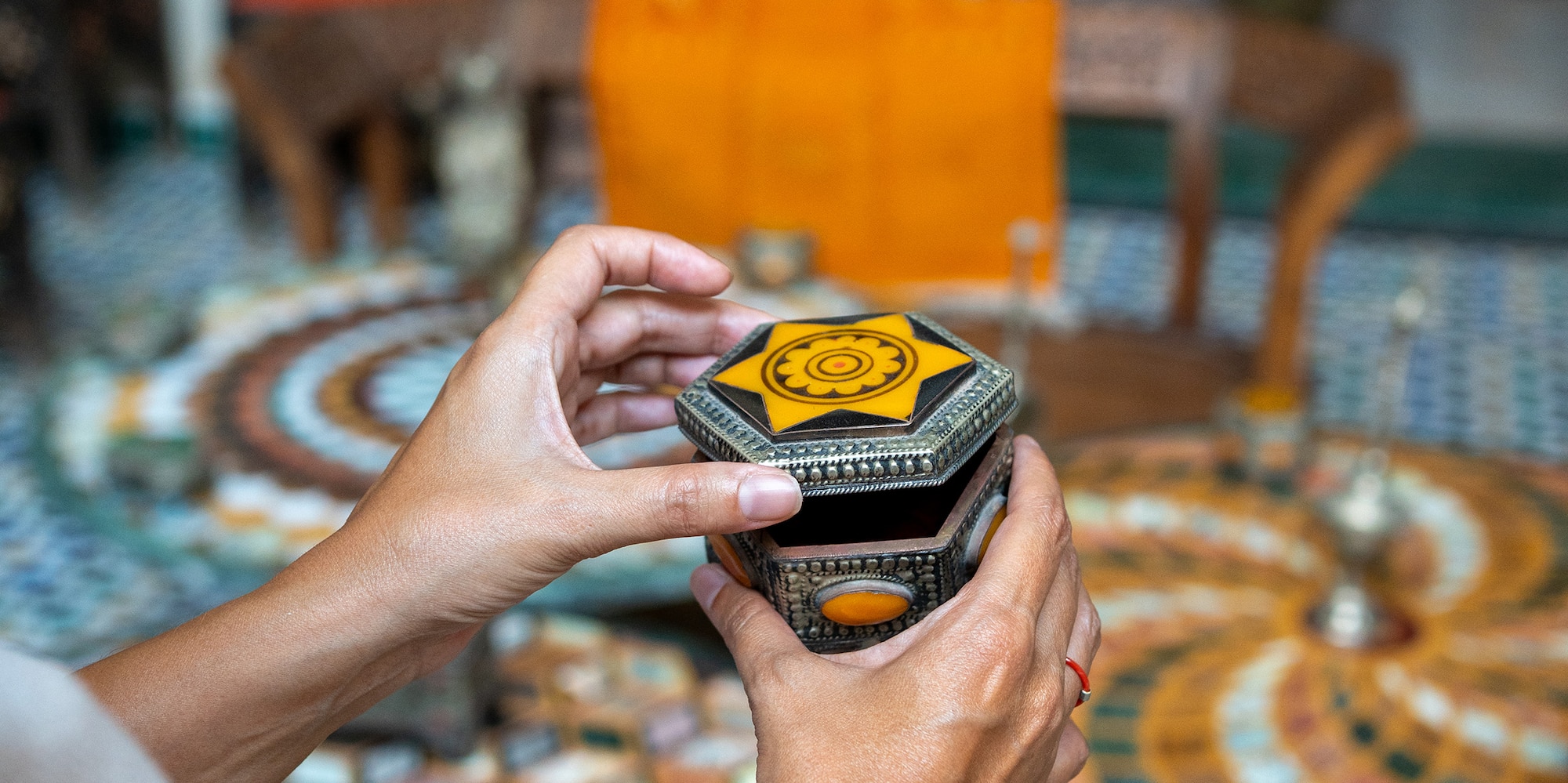 a person holding a small box
