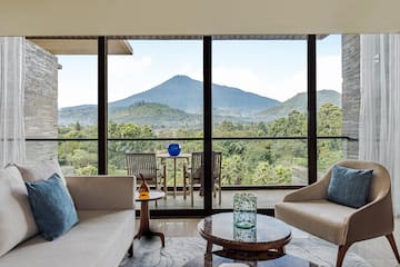 a living room with a view of mountains and trees