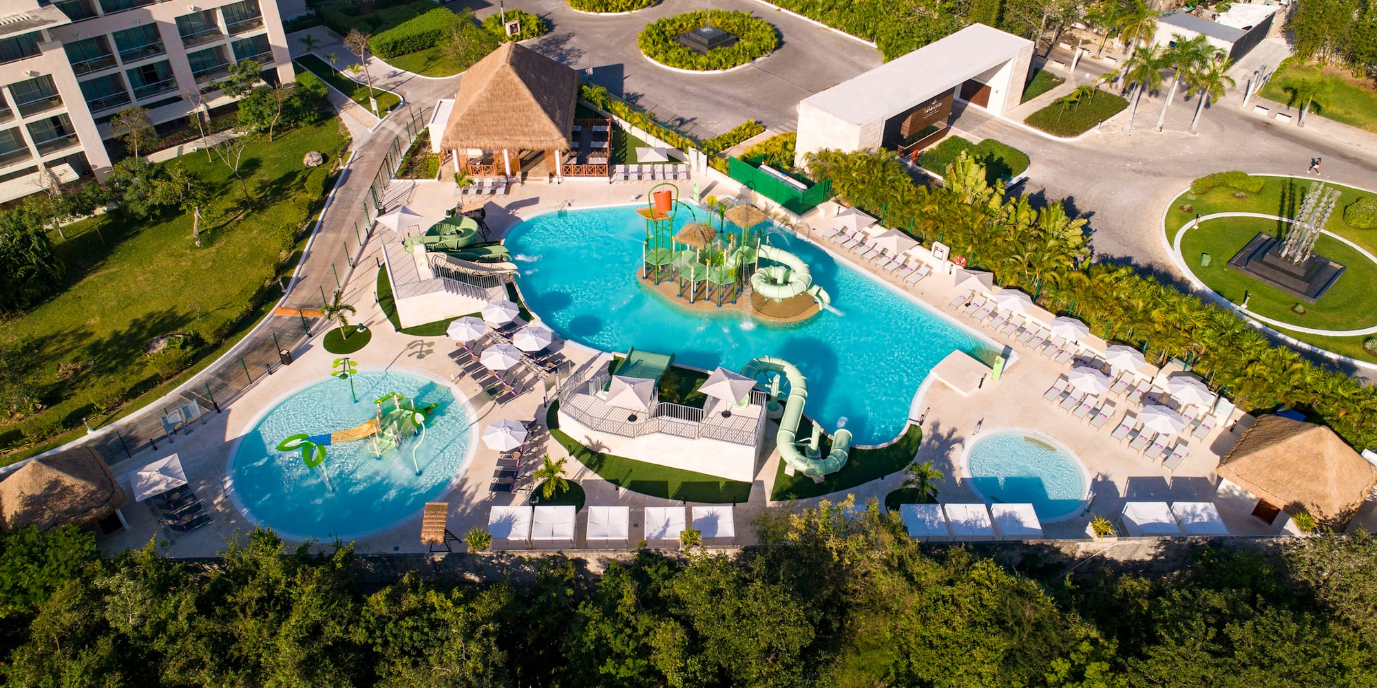 a swimming pool with a slide and a playground