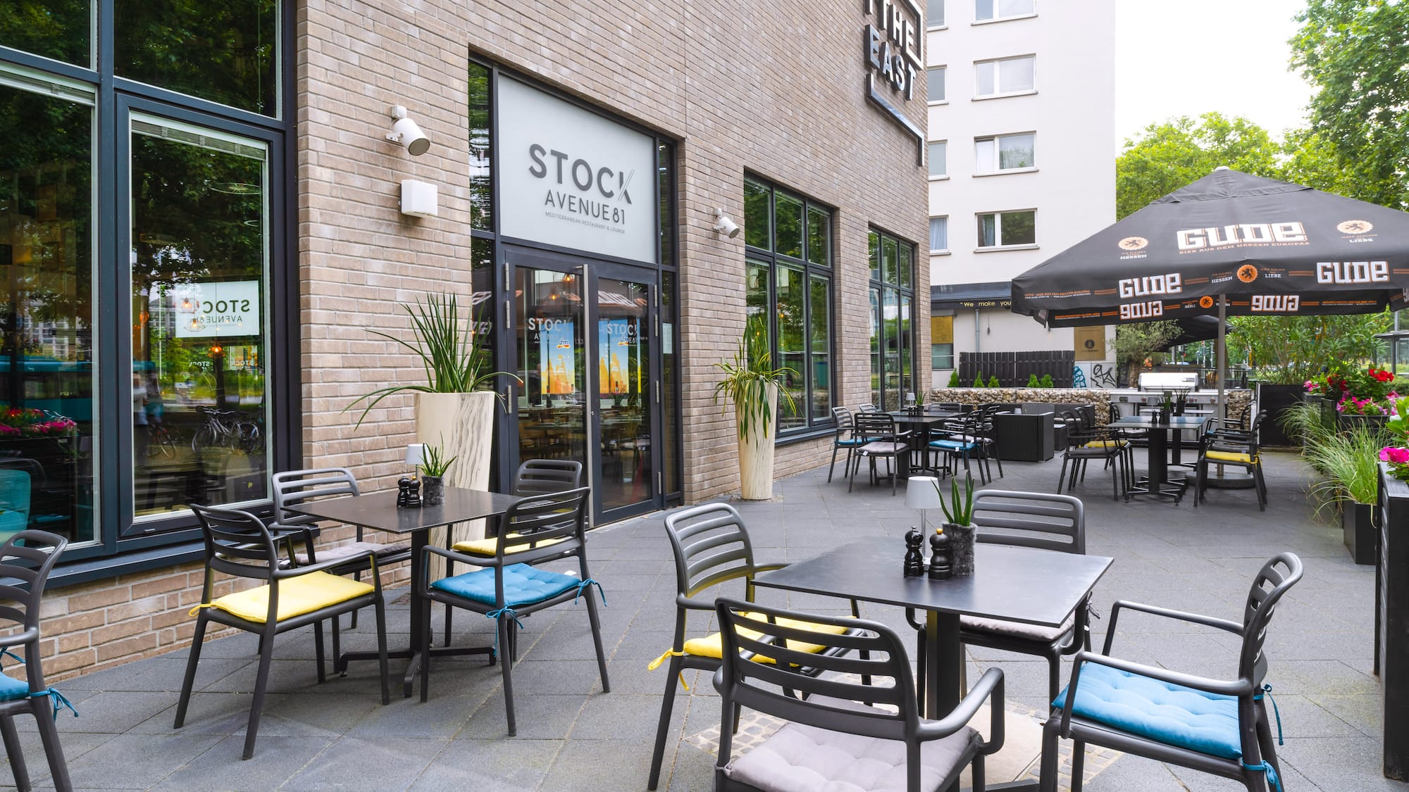 a restaurant with tables and chairs outside