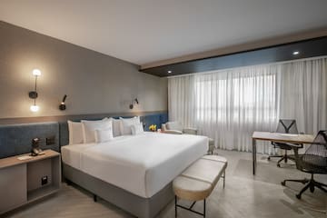 a room with a bed and a desk