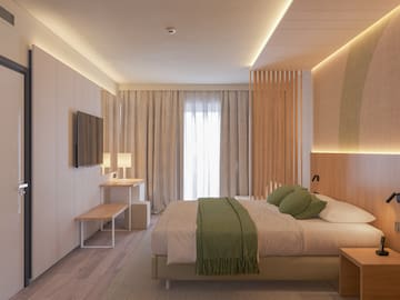 a bedroom with a bed and a tv