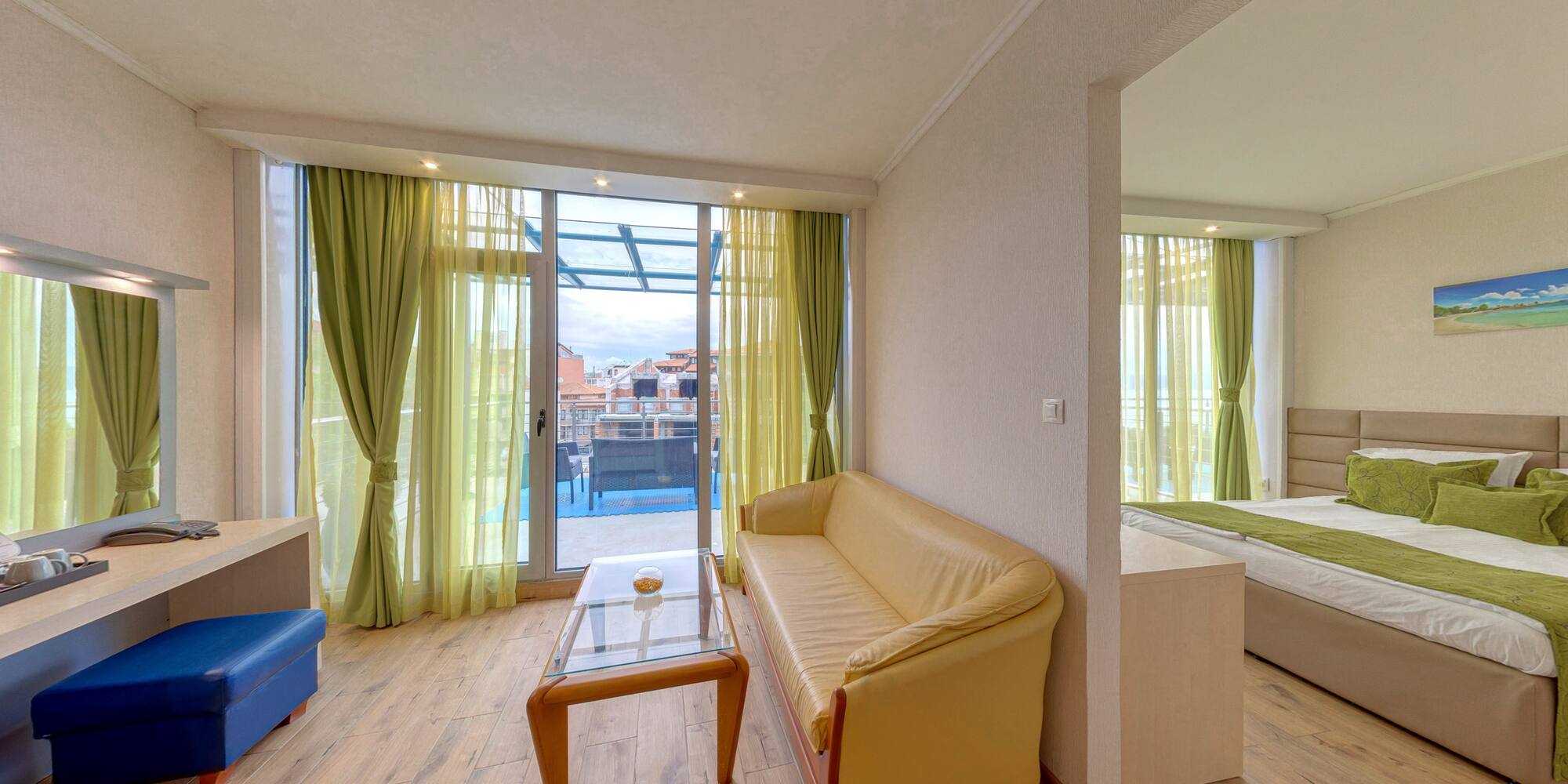 a living room with a couch and a glass table