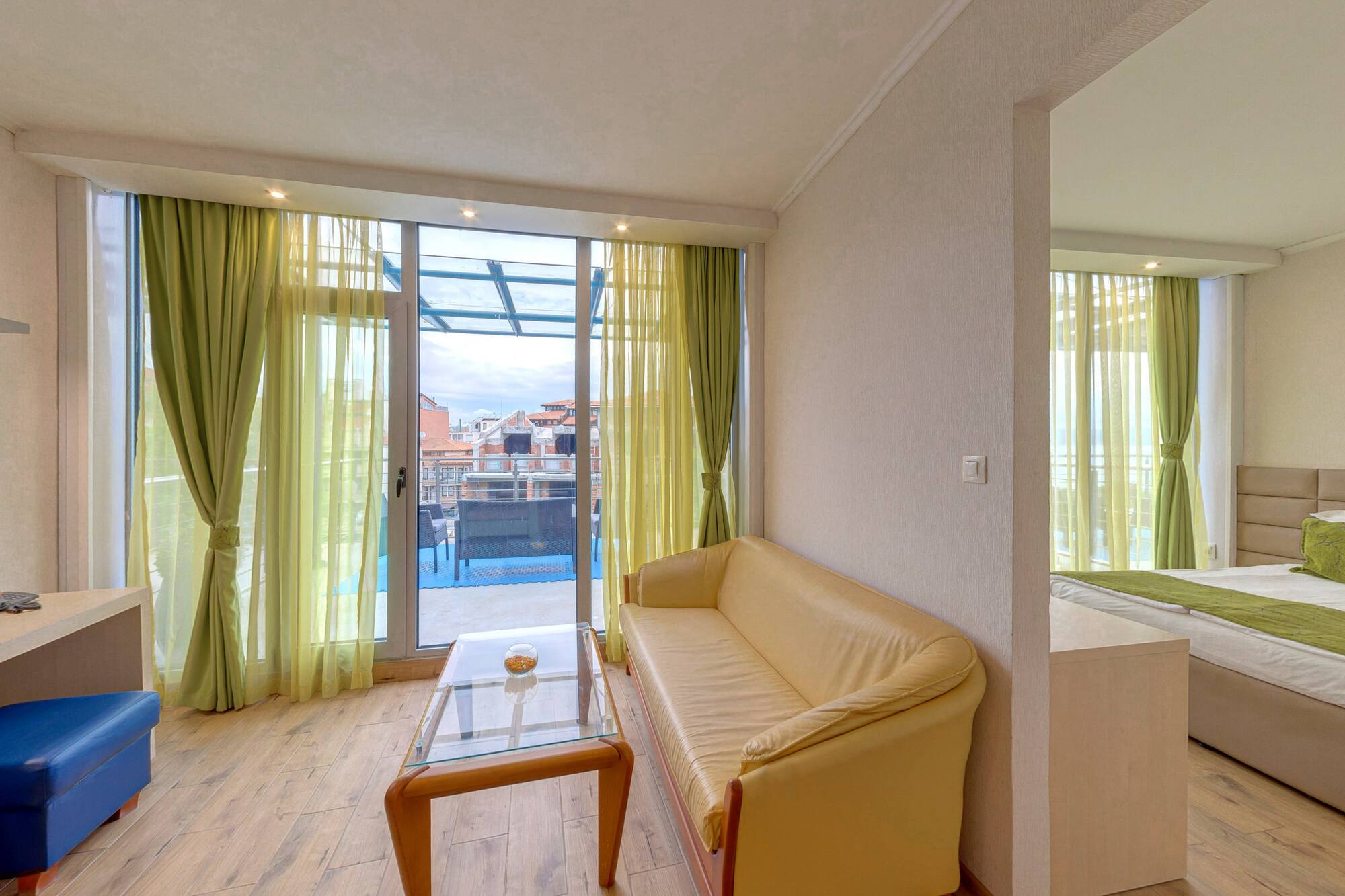 a living room with a couch and a glass table