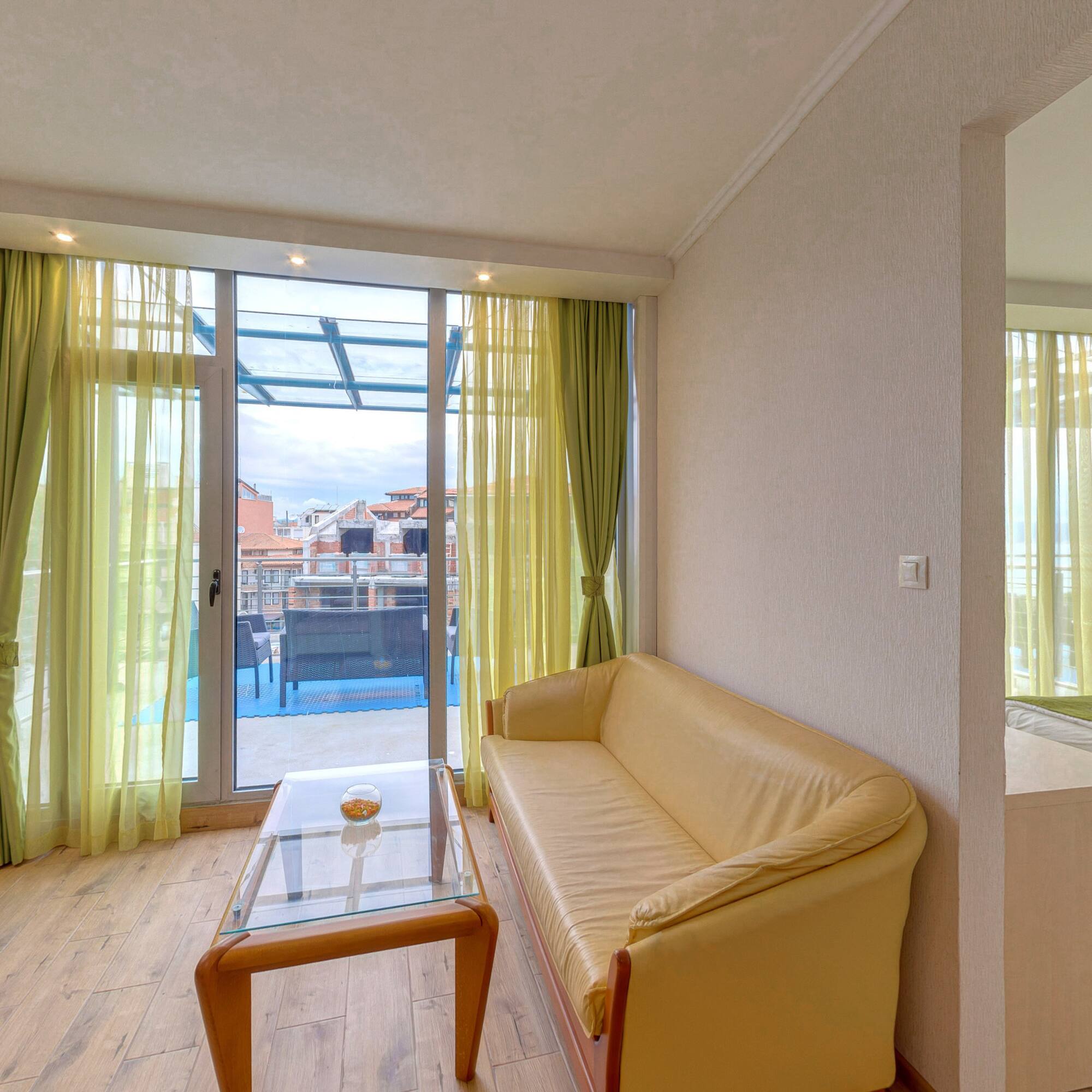 a living room with a couch and a glass table