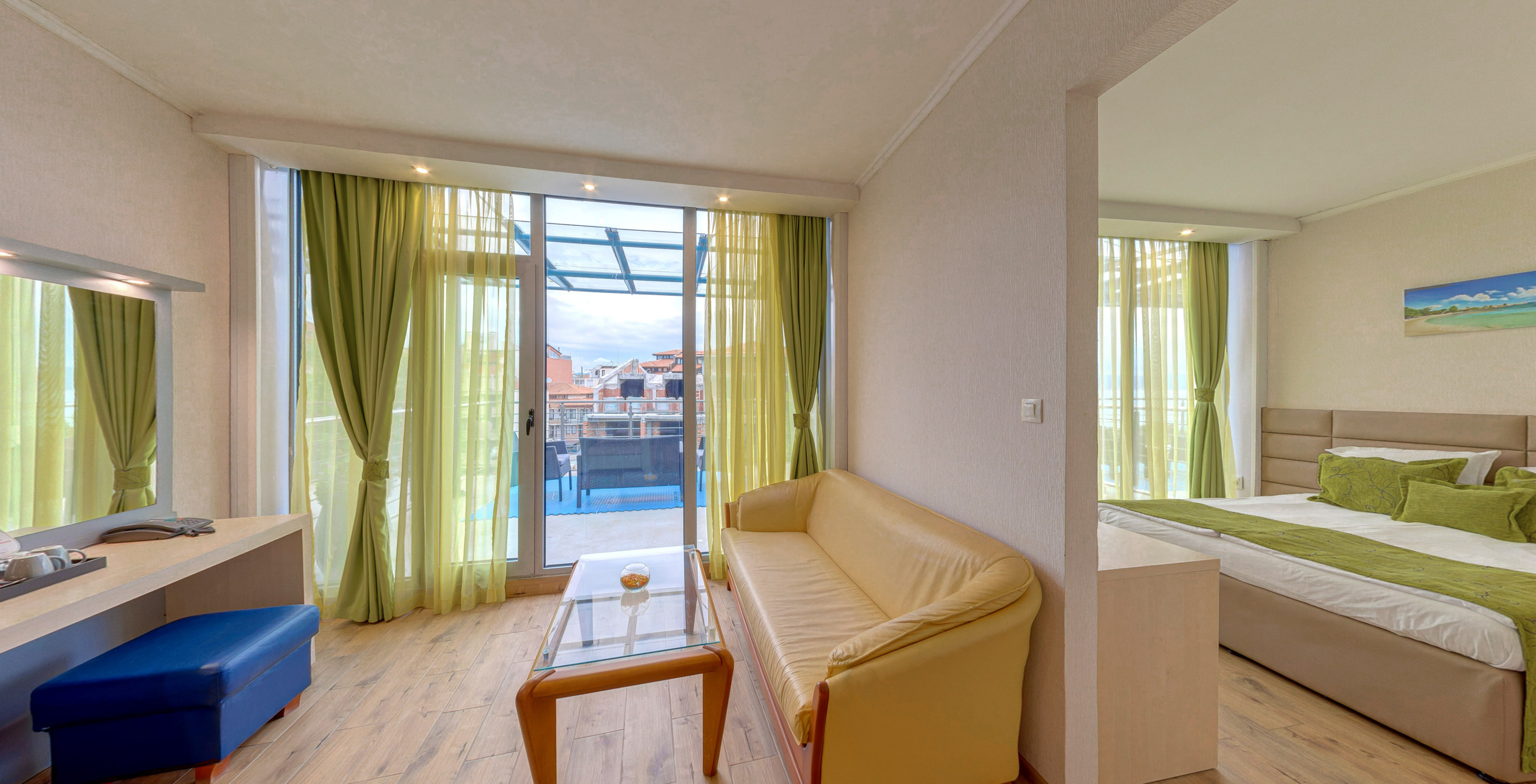a living room with a couch and a glass table
