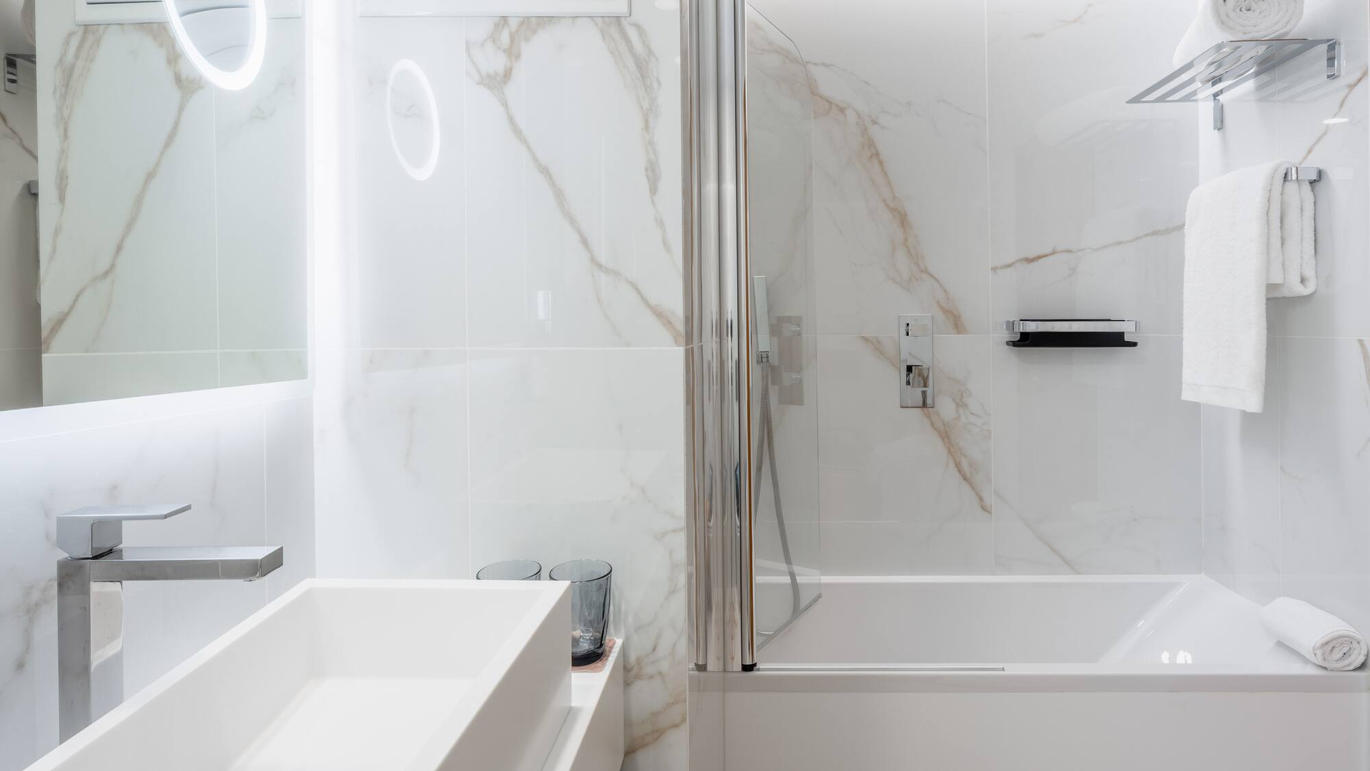 a bathroom with a sink and shower