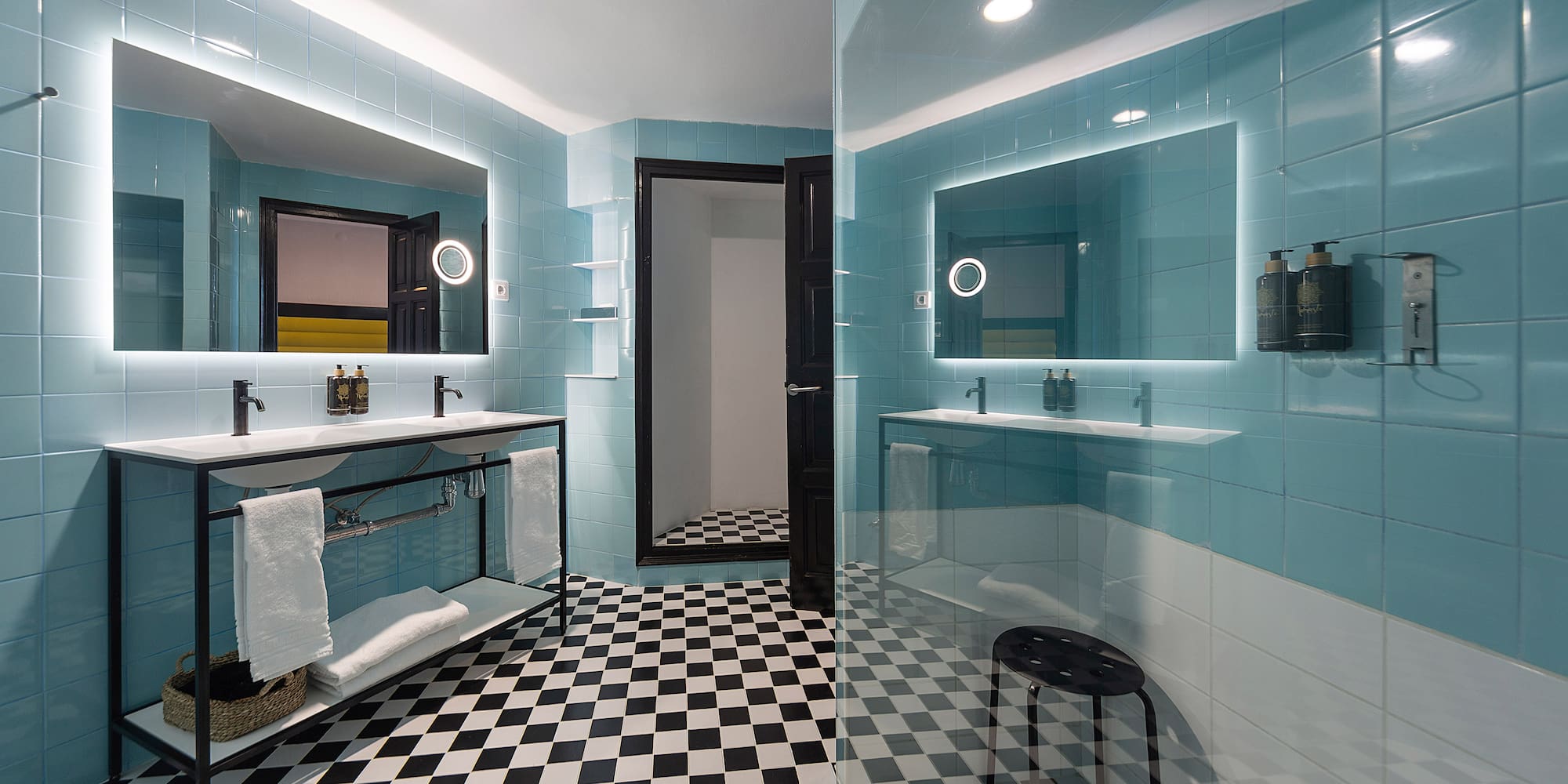 a bathroom with a mirror and a shower