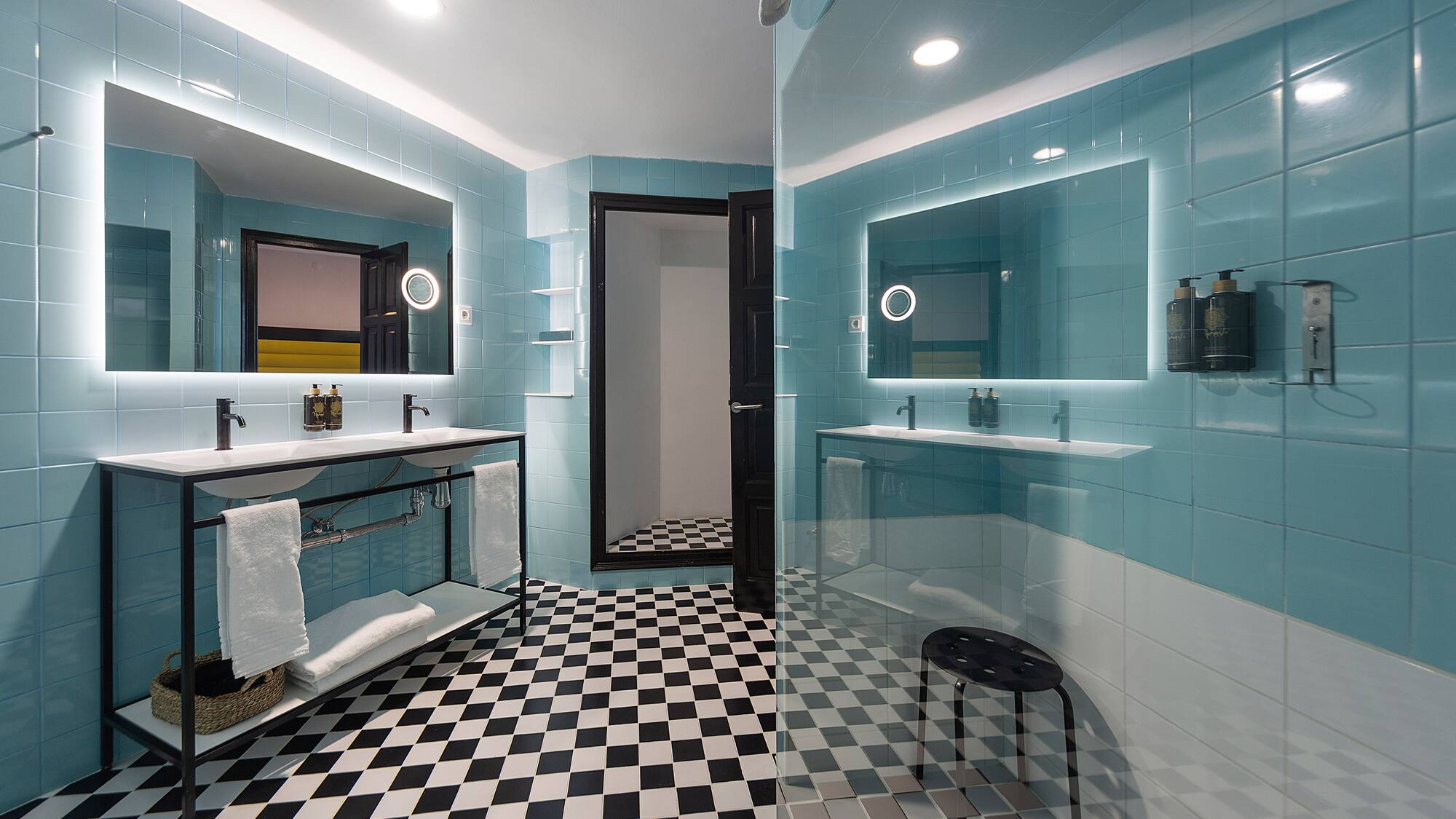 a bathroom with a mirror and a shower