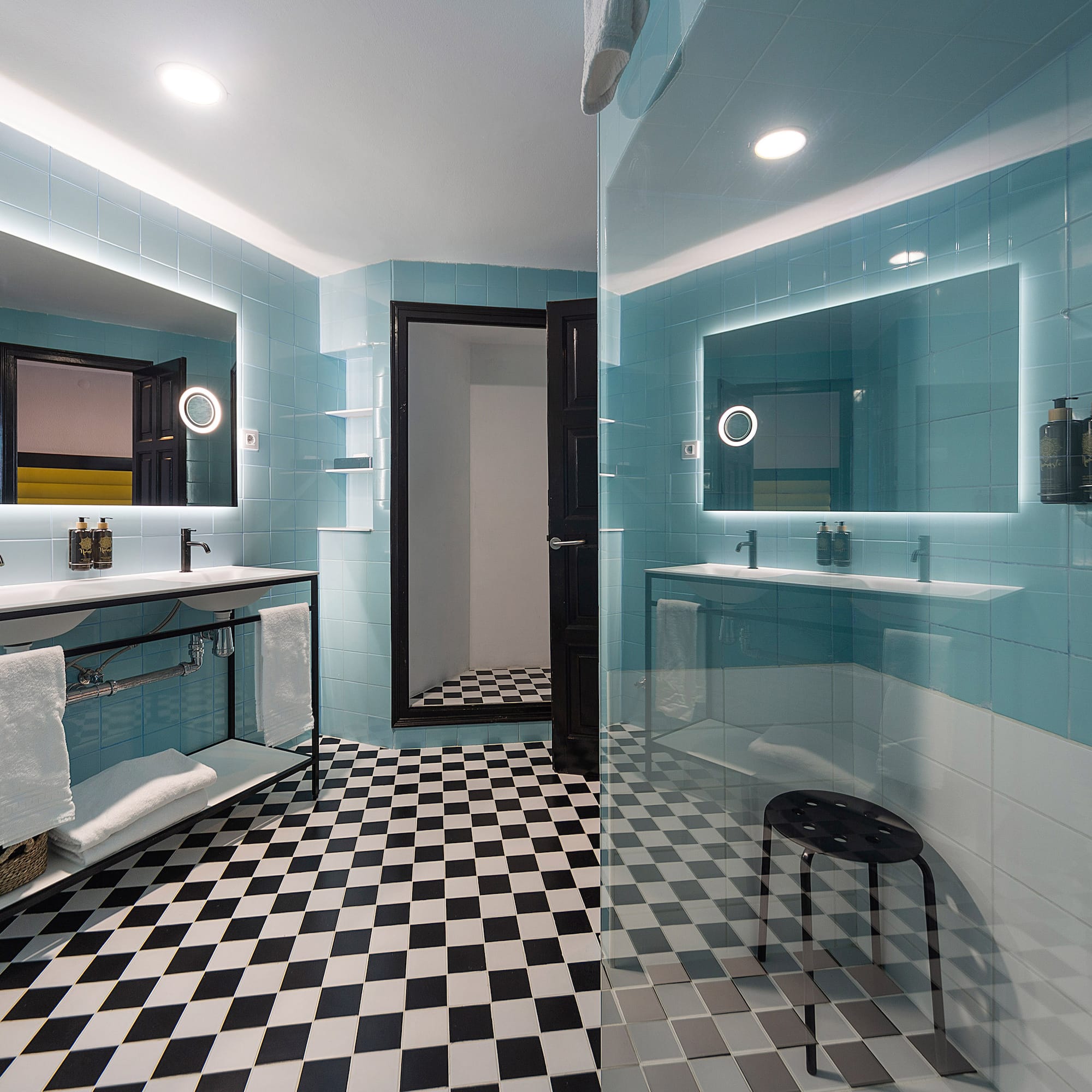 a bathroom with a mirror and a shower