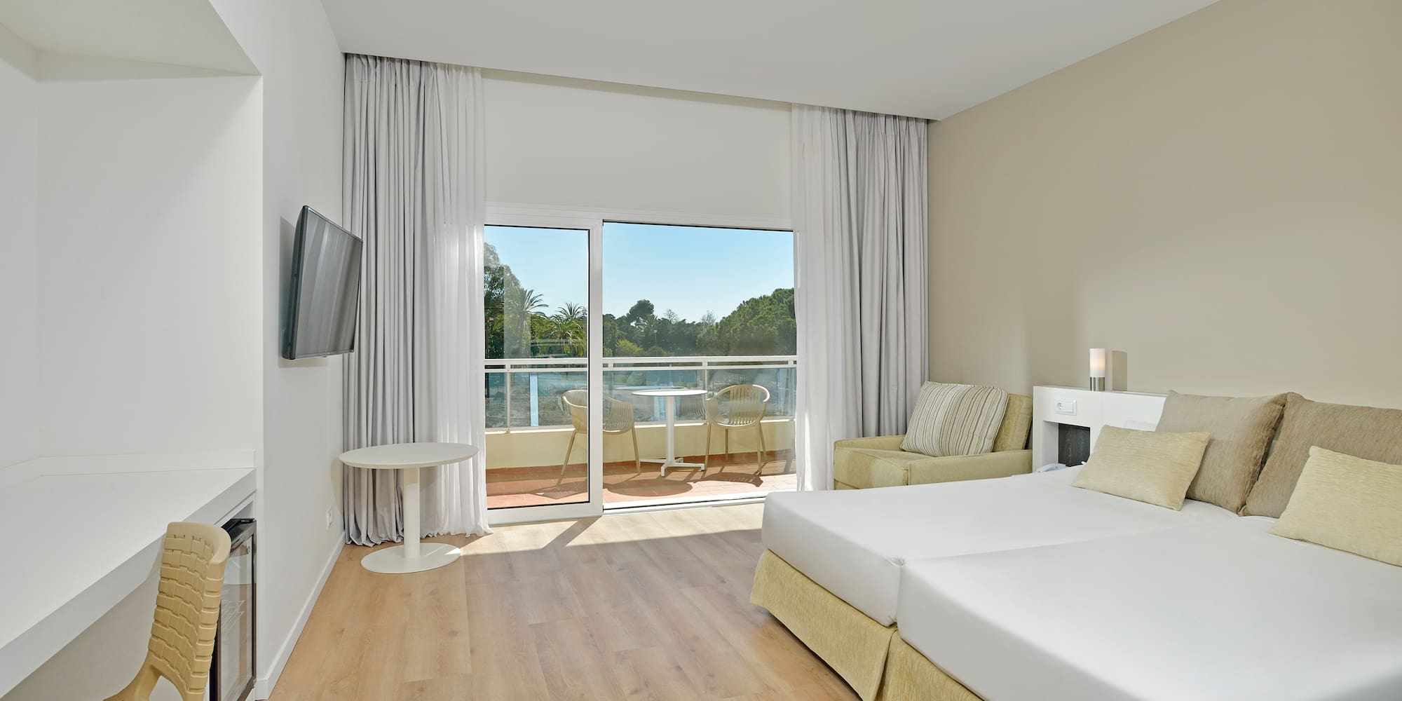 a room with a bed and a television