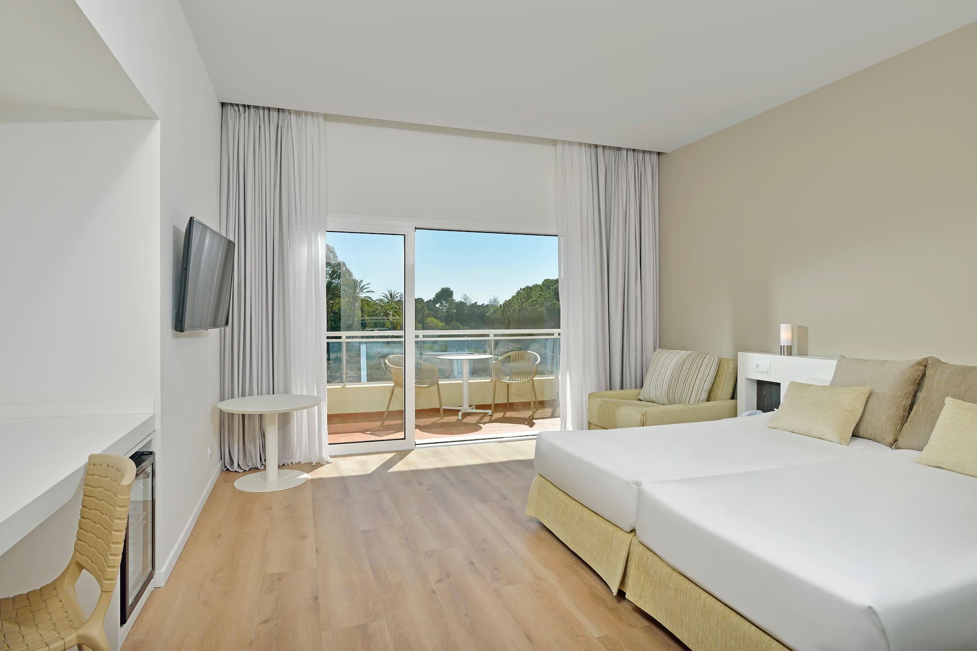 a room with a bed and a television