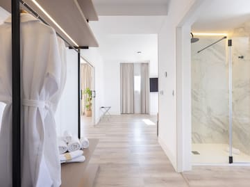 a room with white walls and a shower