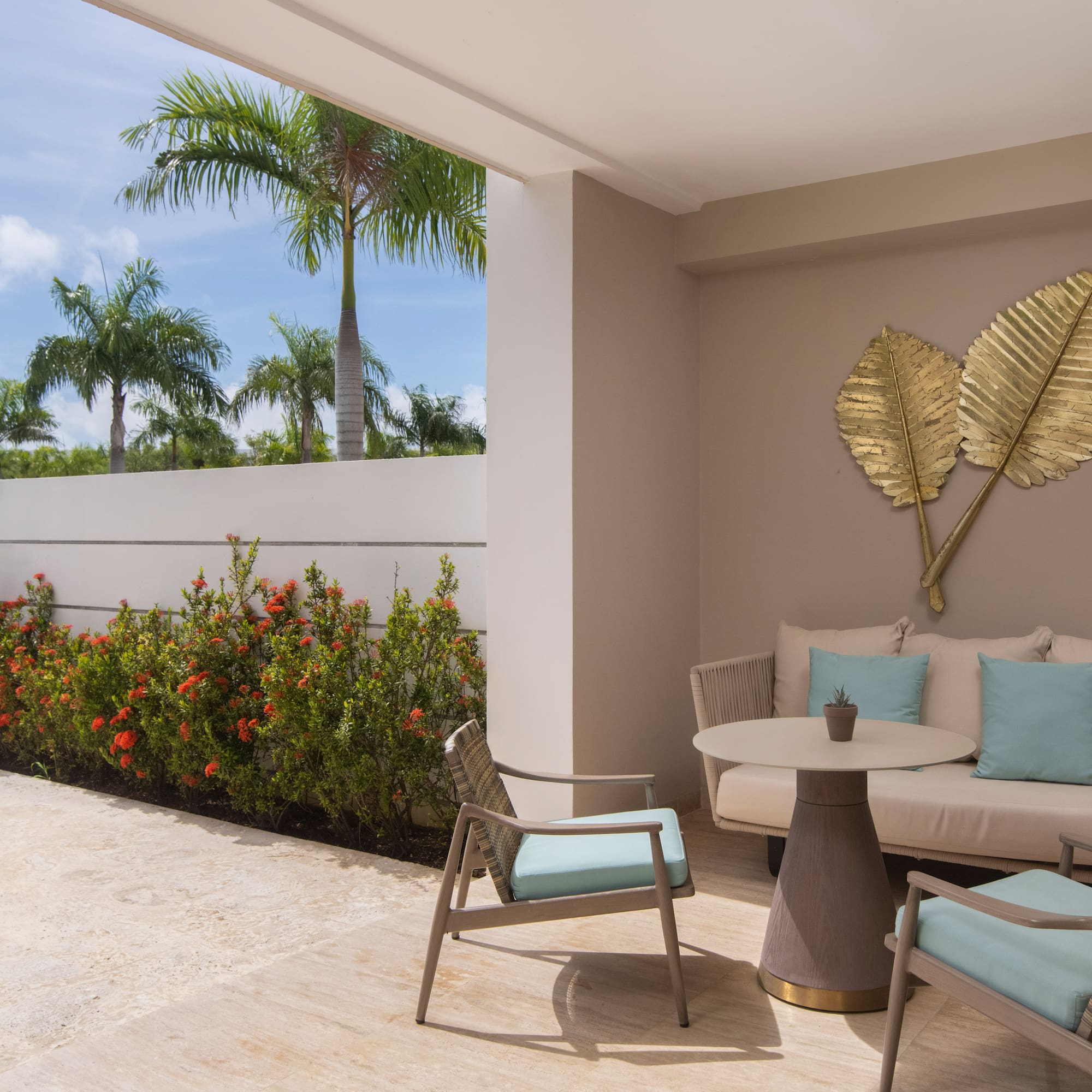 a patio with a table and chairs