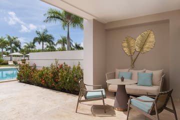 a patio with a table and chairs