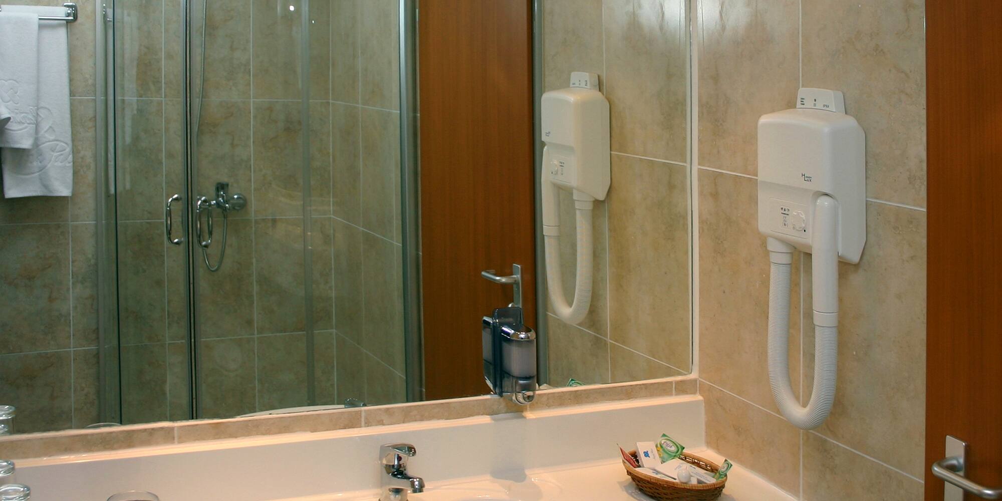 a bathroom with a mirror and sink