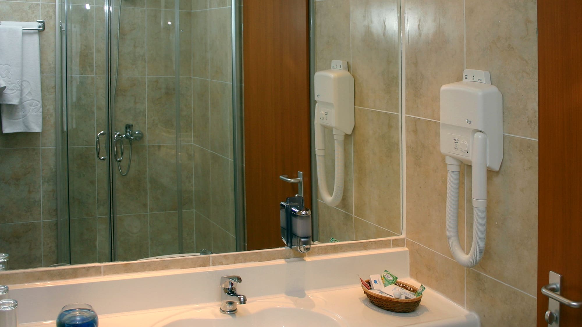 a bathroom with a mirror and sink