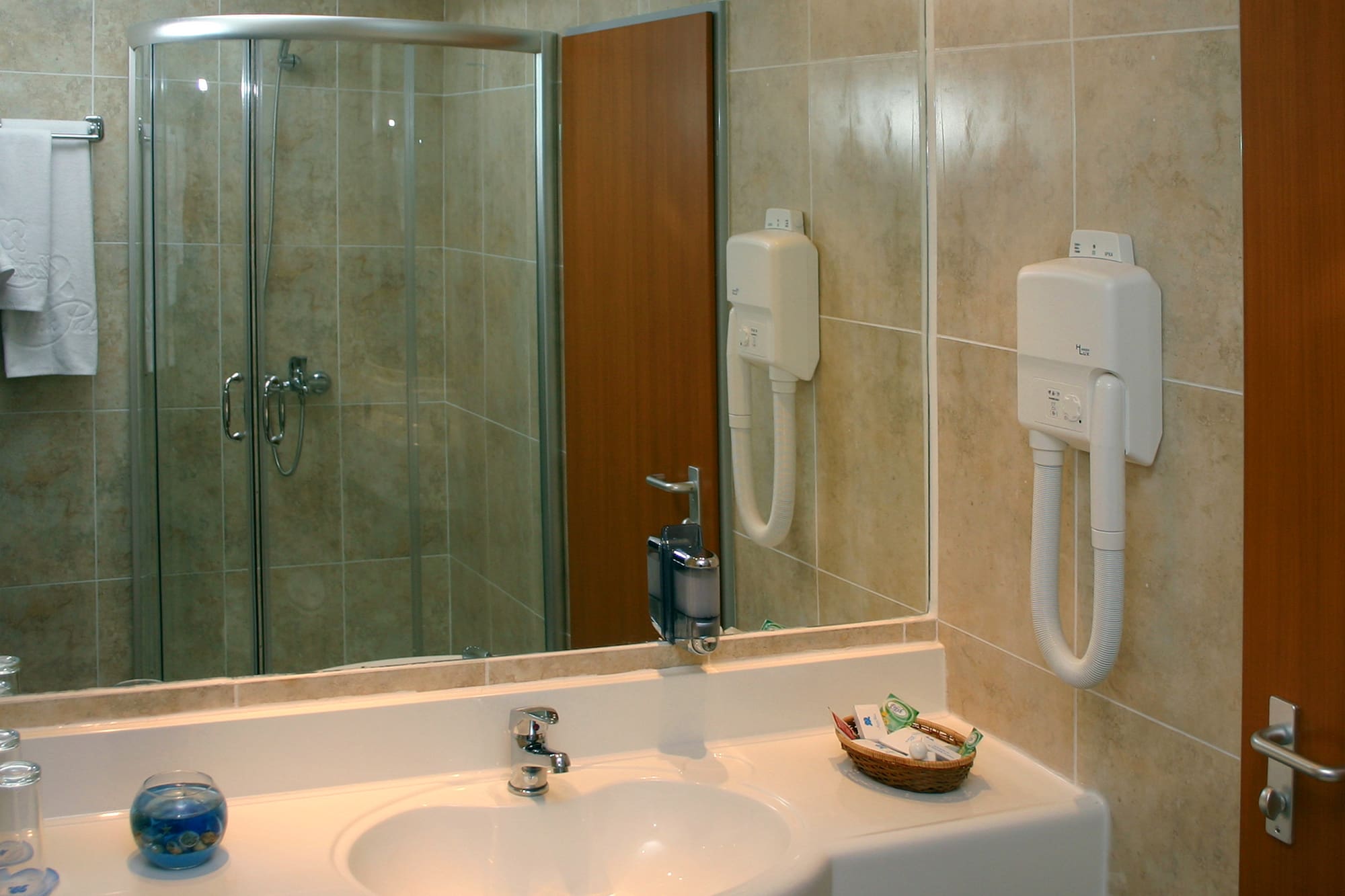 a bathroom with a mirror and sink