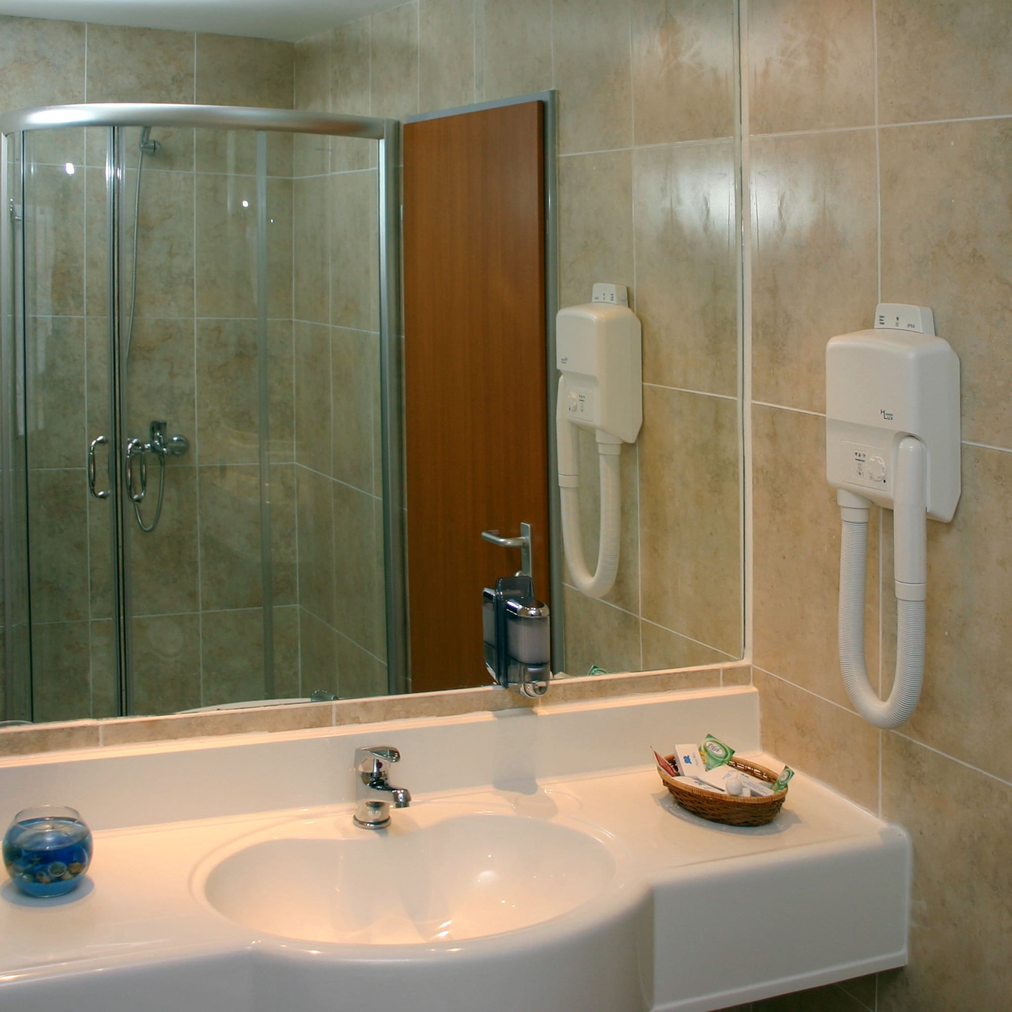 a bathroom with a mirror and sink