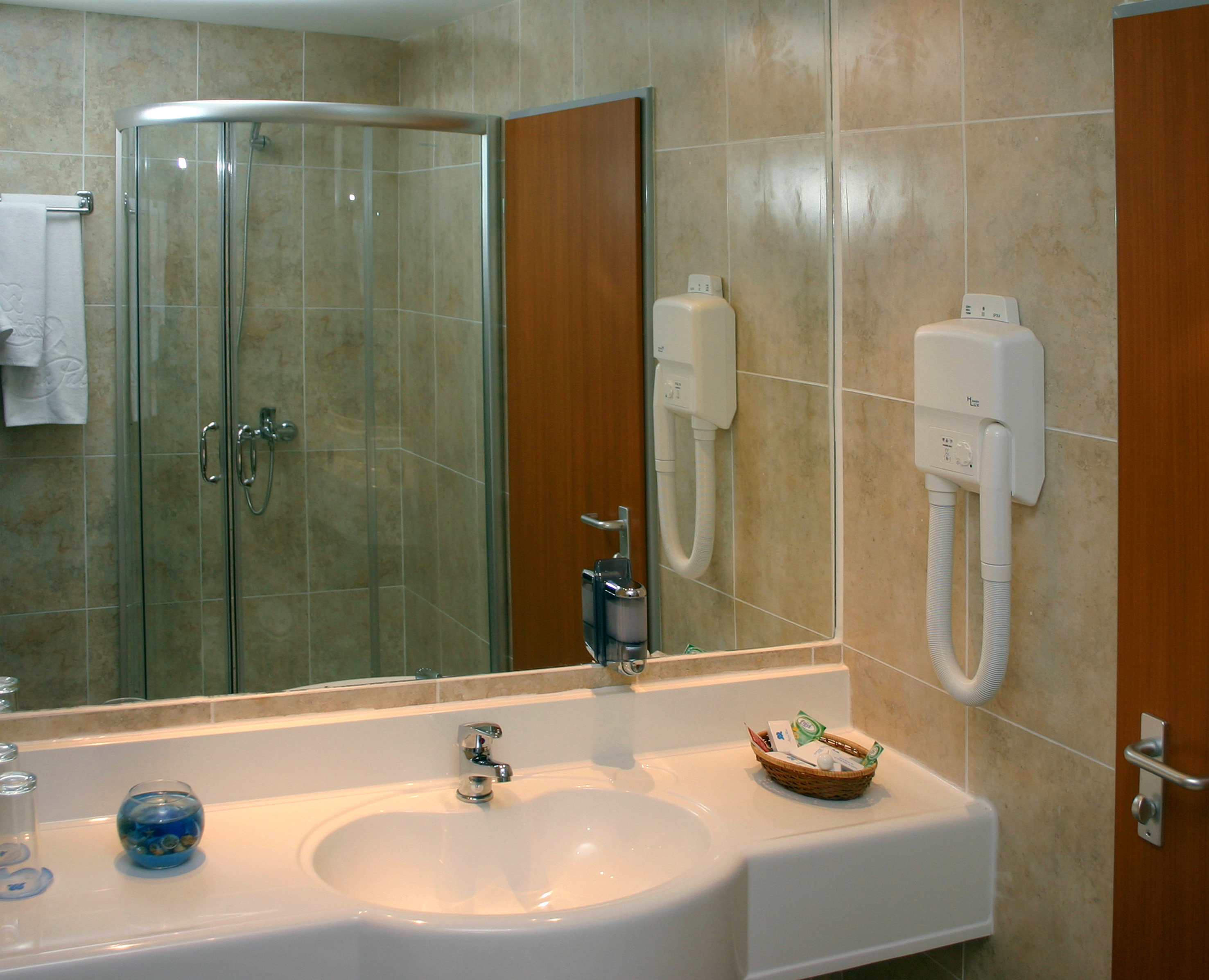 a bathroom with a mirror and sink