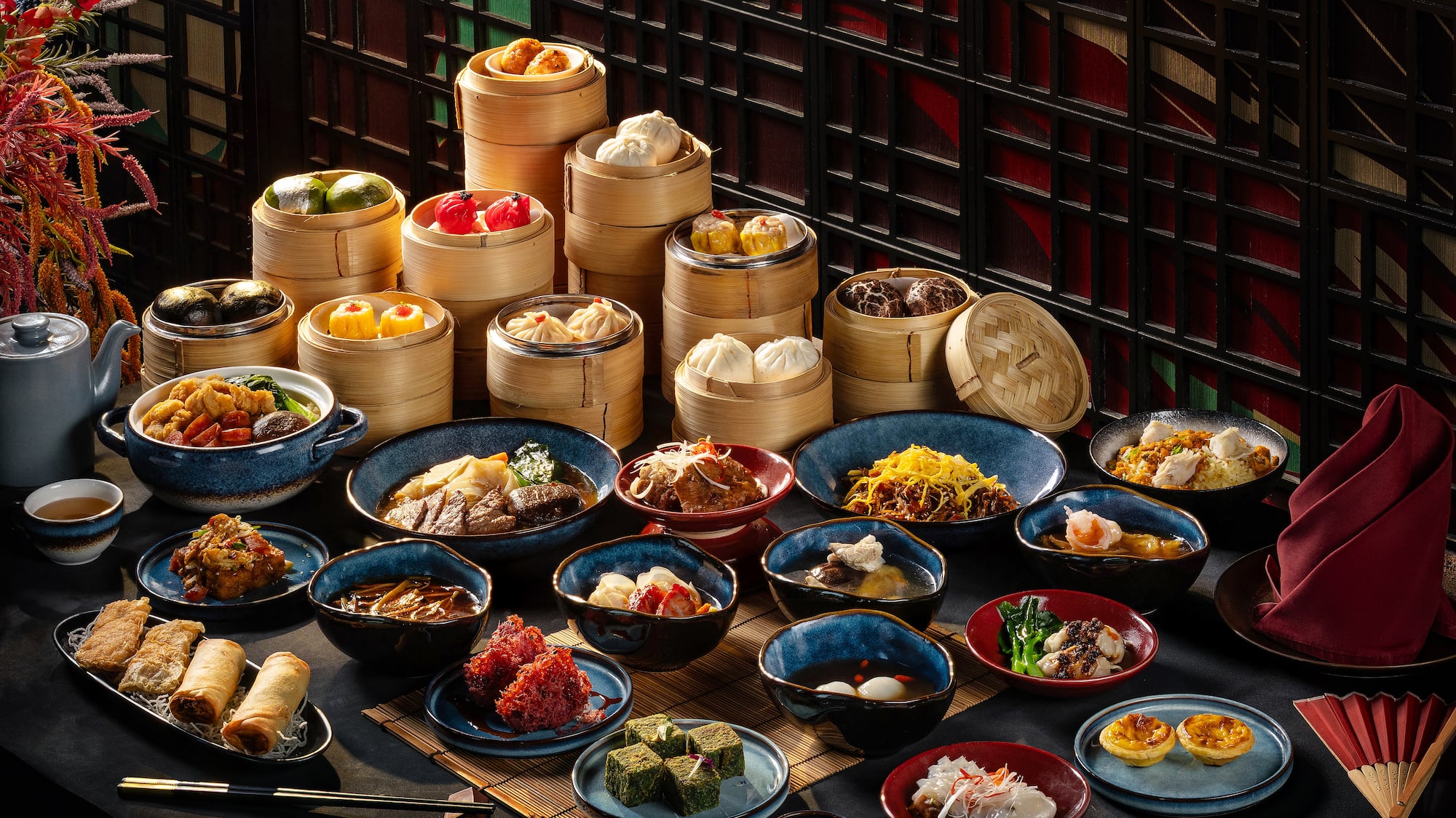 A generous spread of colorful Chinese dim sum, dumplings, and traditional dishes.