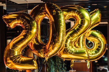 a gold balloons in the shape of numbers