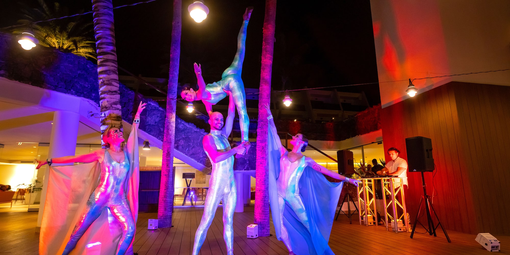 a group of people in clothing on a deck