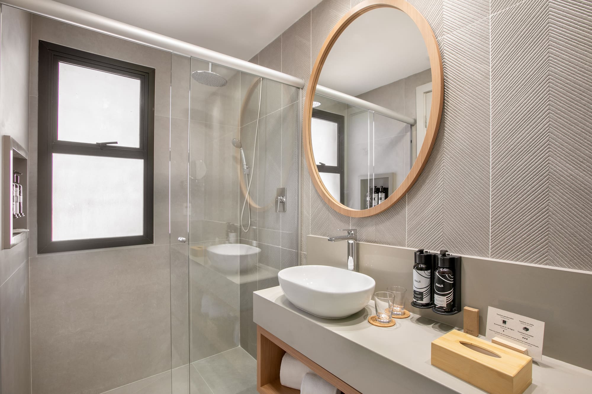 a bathroom with a mirror and a sink