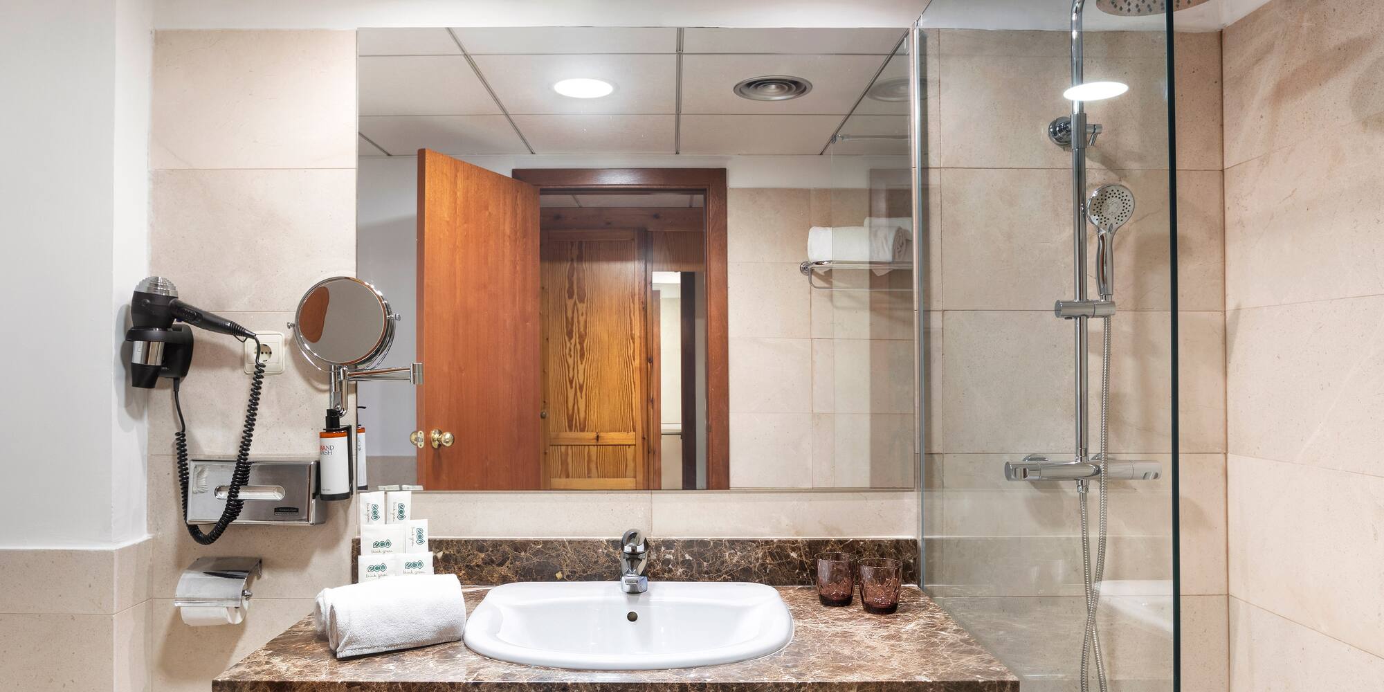 a bathroom with a shower and sink