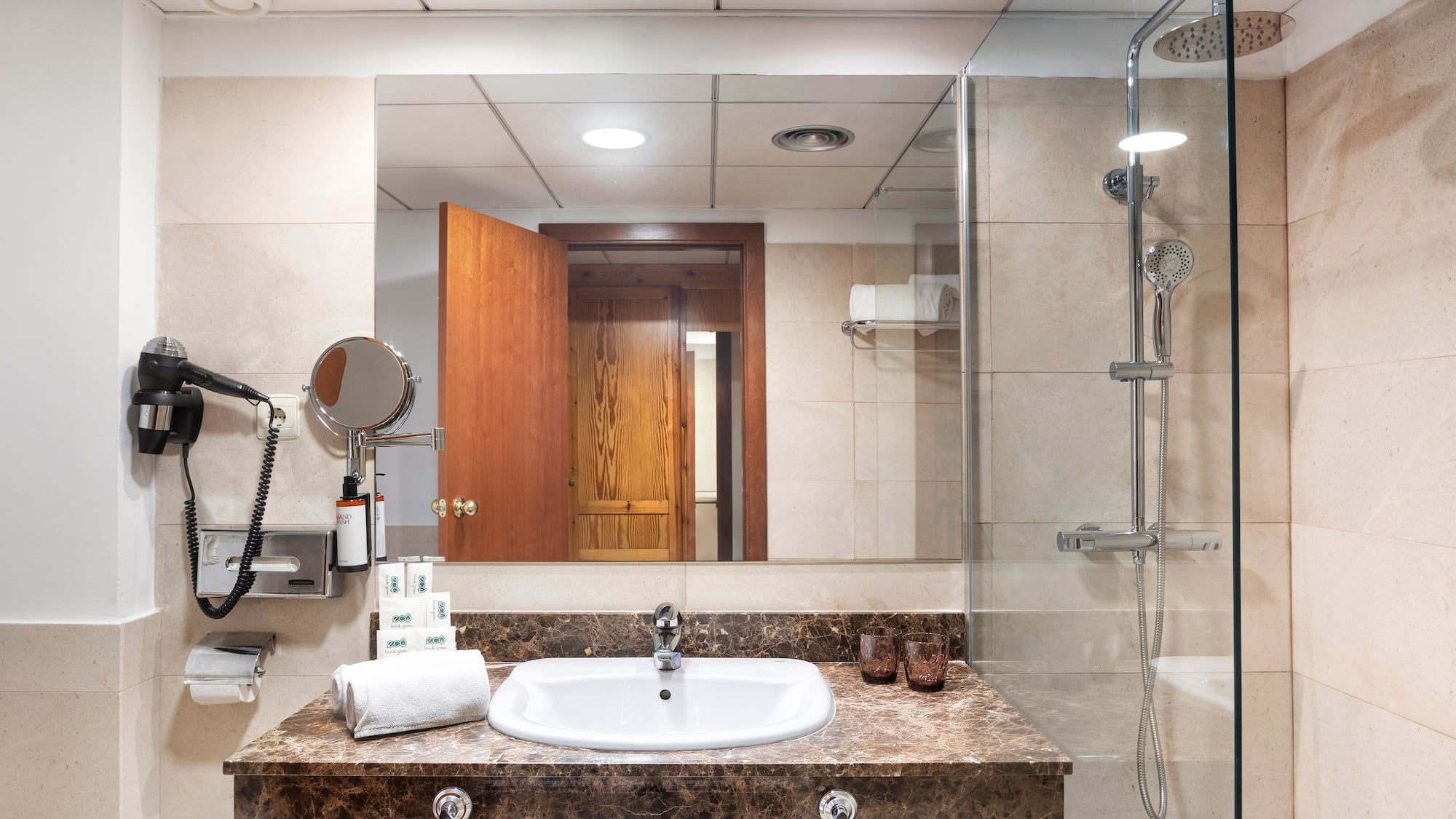 a bathroom with a shower and sink