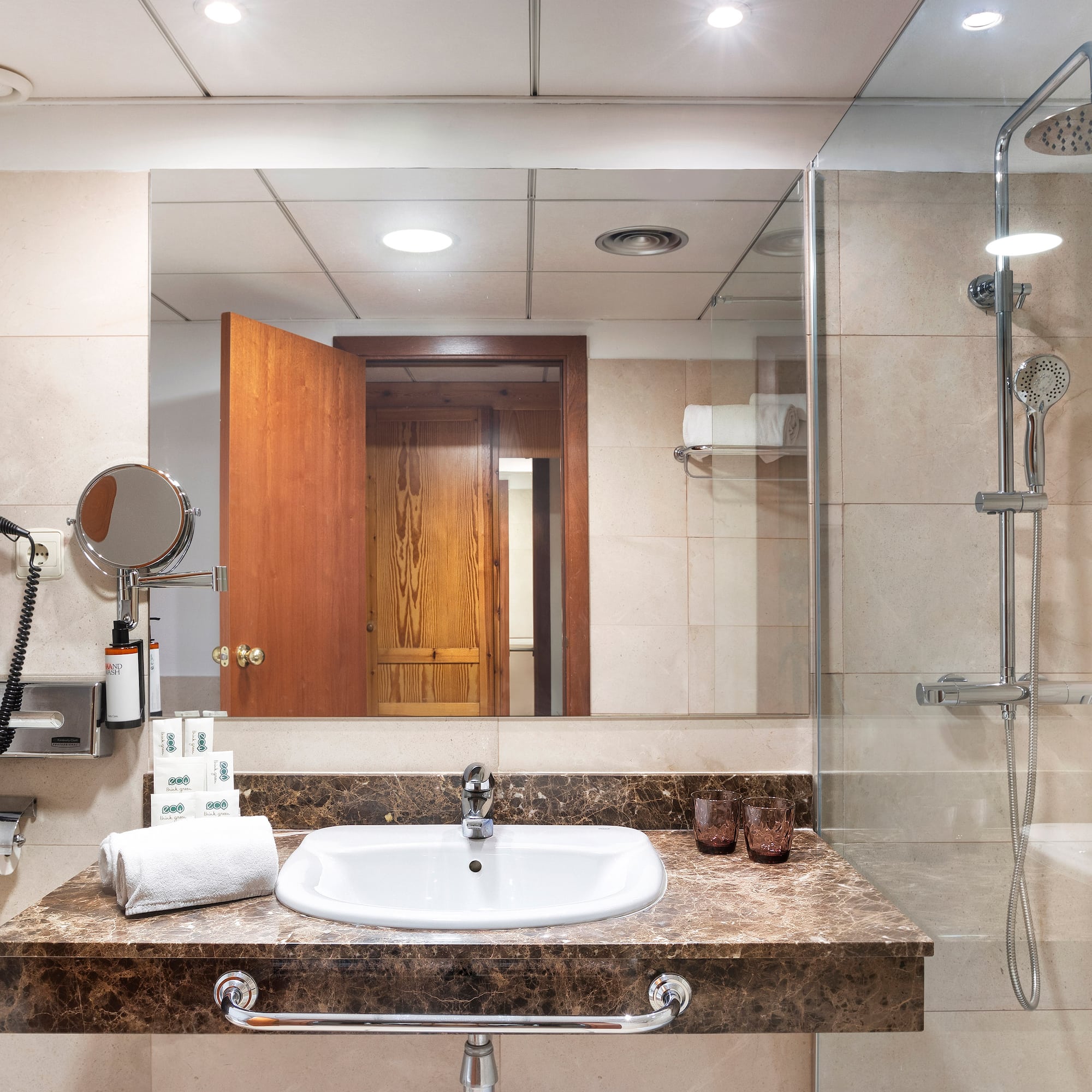 a bathroom with a shower and sink