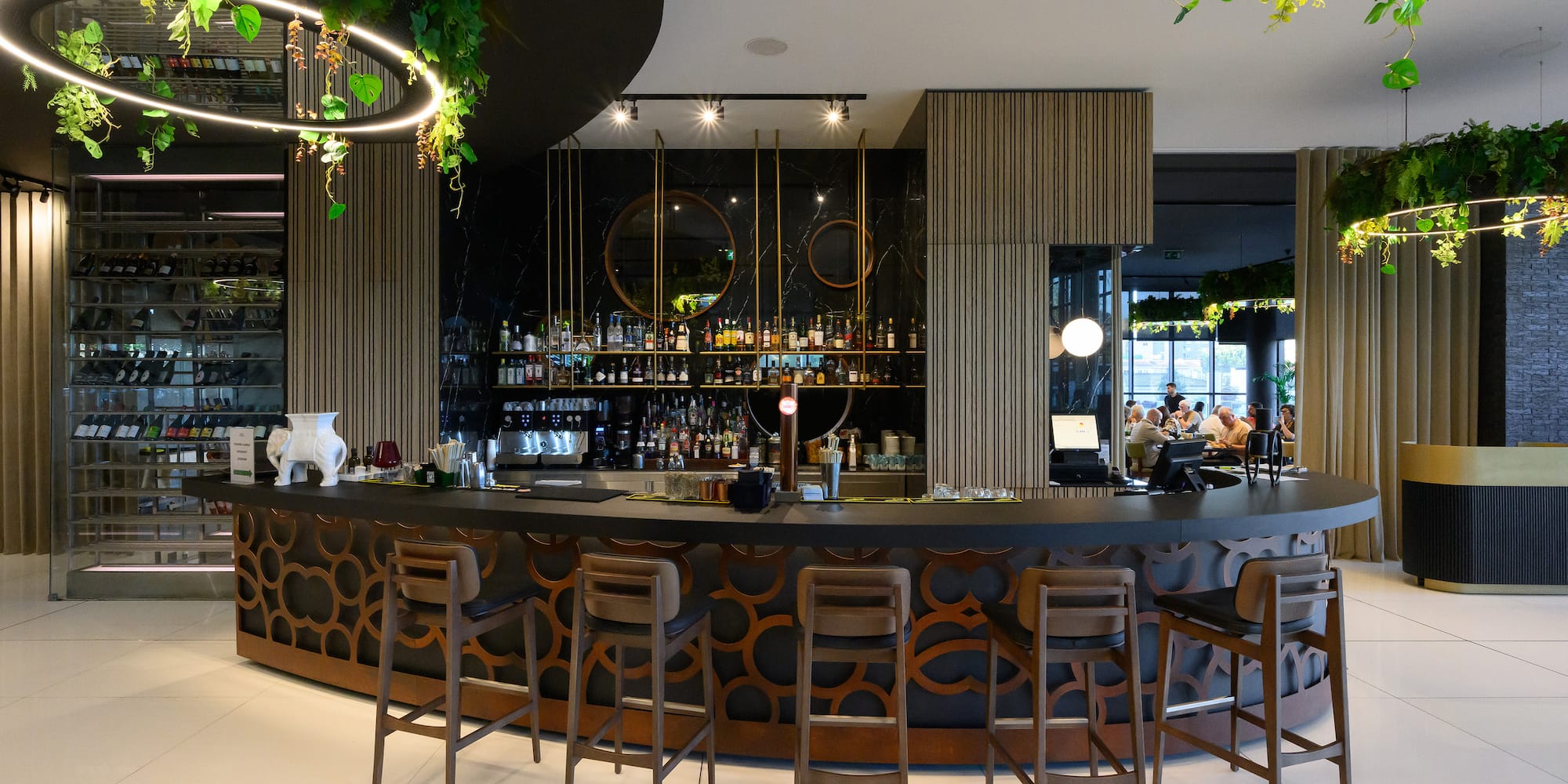 a bar with chairs and a counter