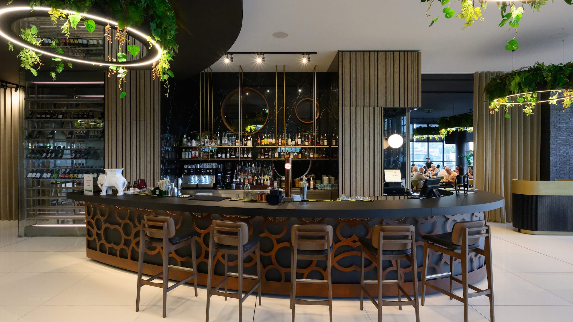 a bar with chairs and a counter