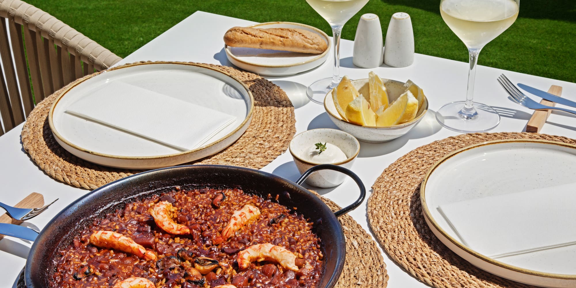 a table with food and glasses of wine