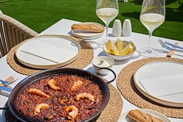 a table with food and glasses of wine