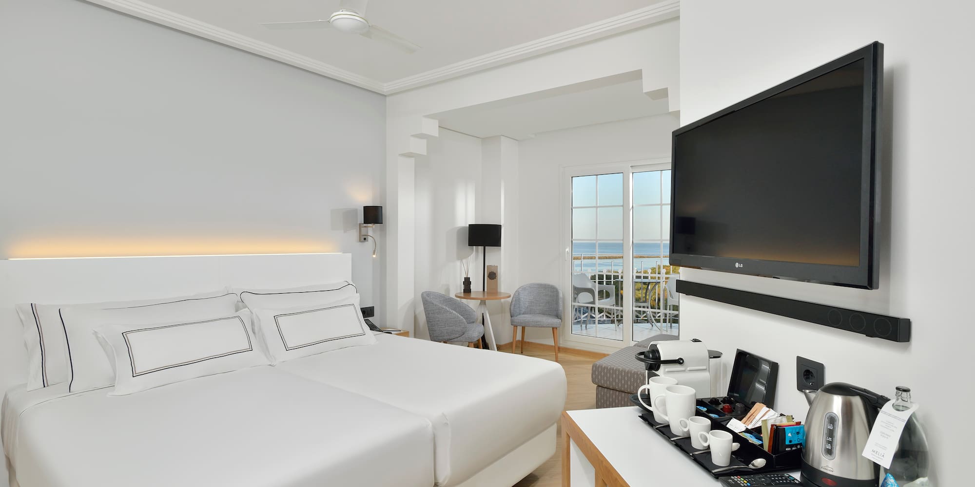 a room with a television and a bed