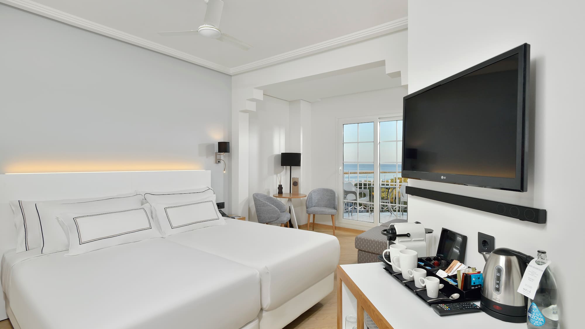 a room with a television and a bed