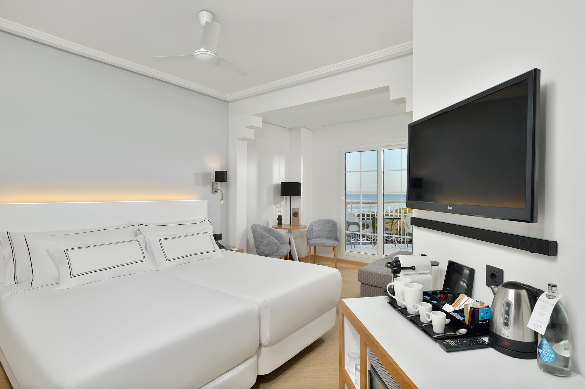 a room with a television and a bed