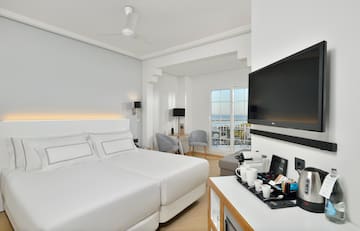 a room with a television and a bed