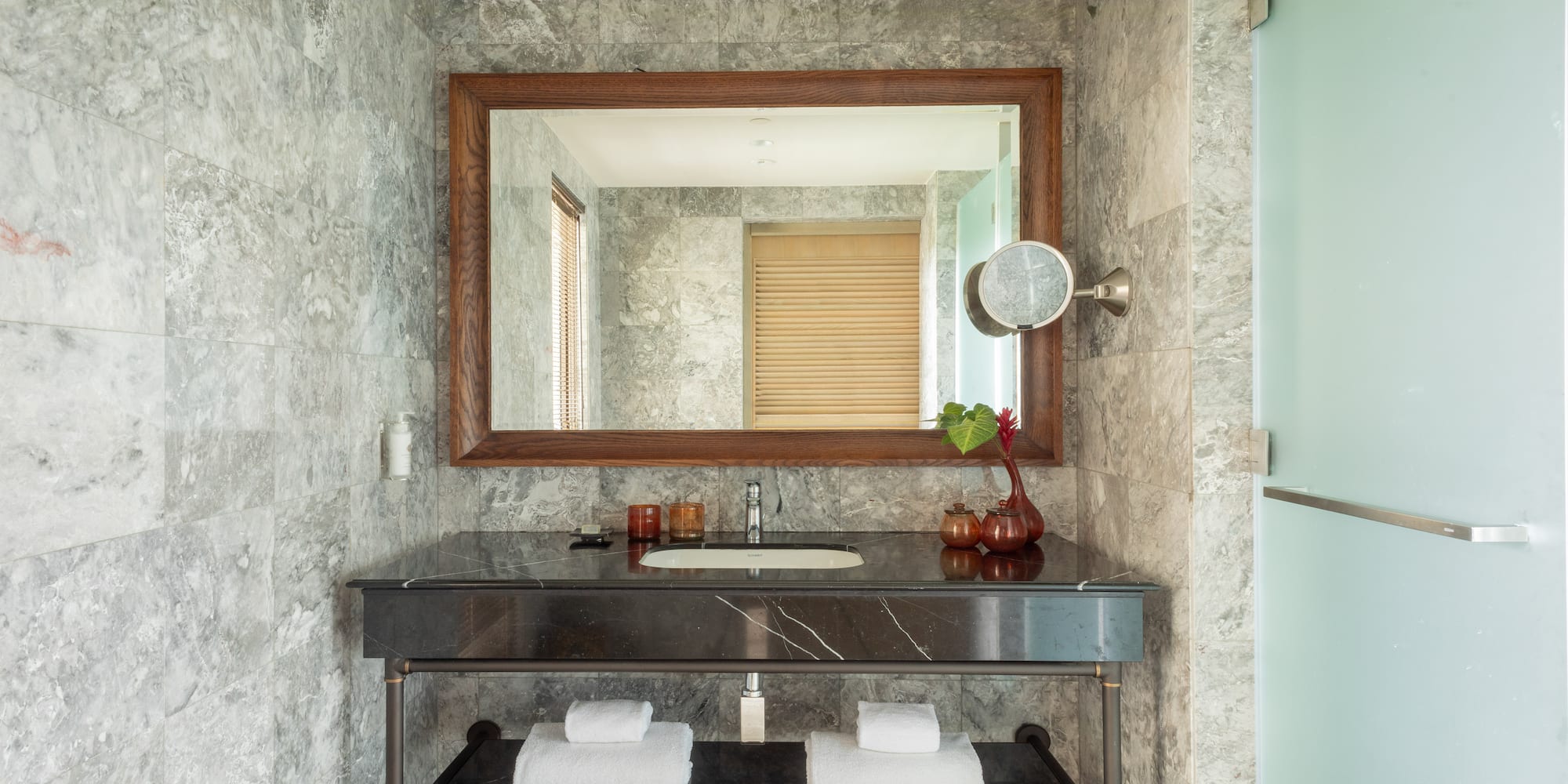 a bathroom with a mirror and a sink