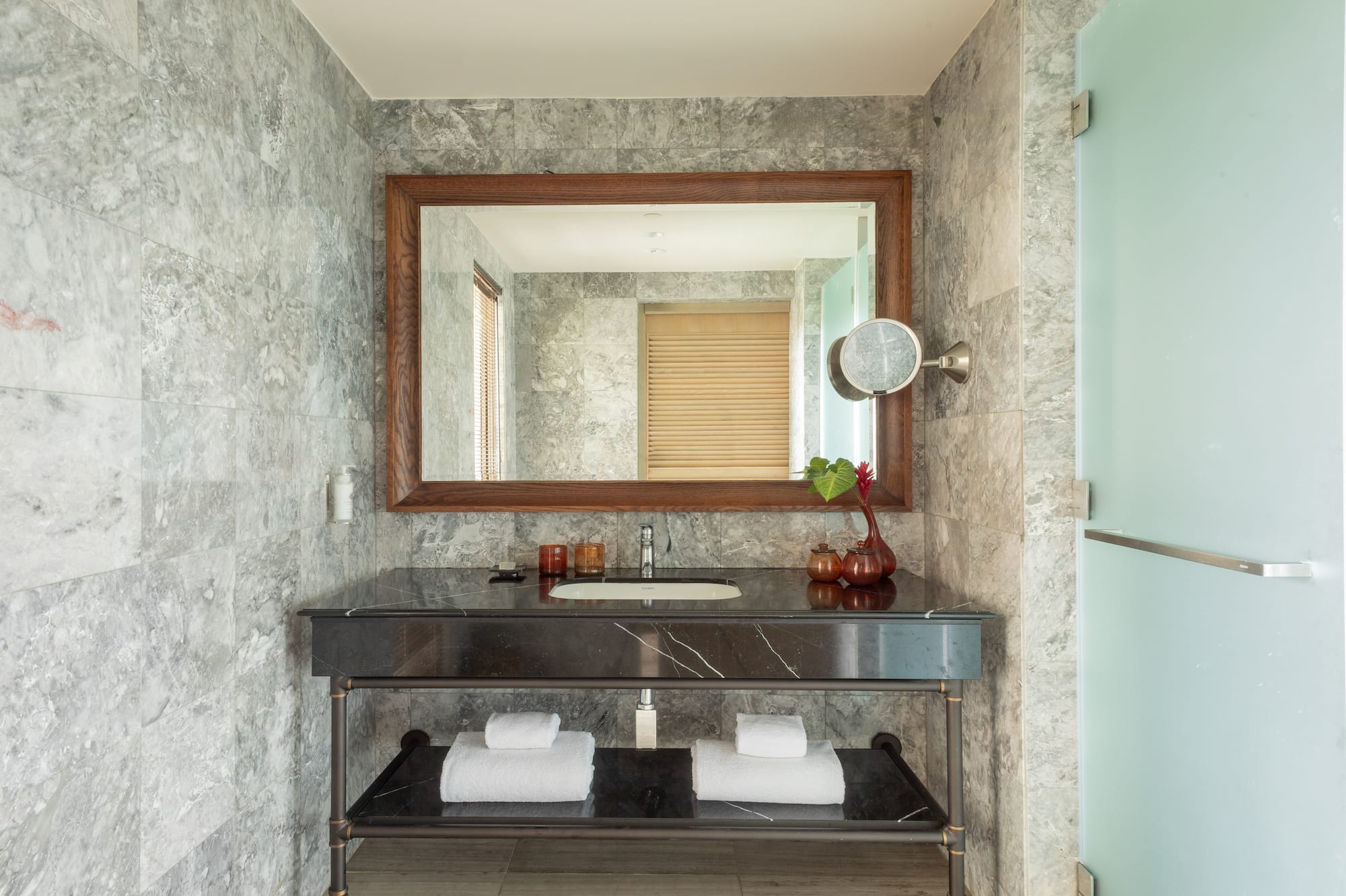 a bathroom with a mirror and a sink