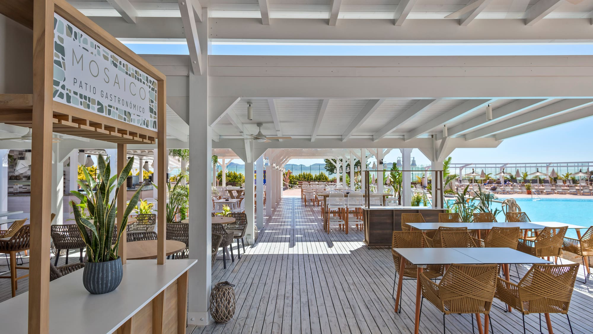 a patio with tables and chairs