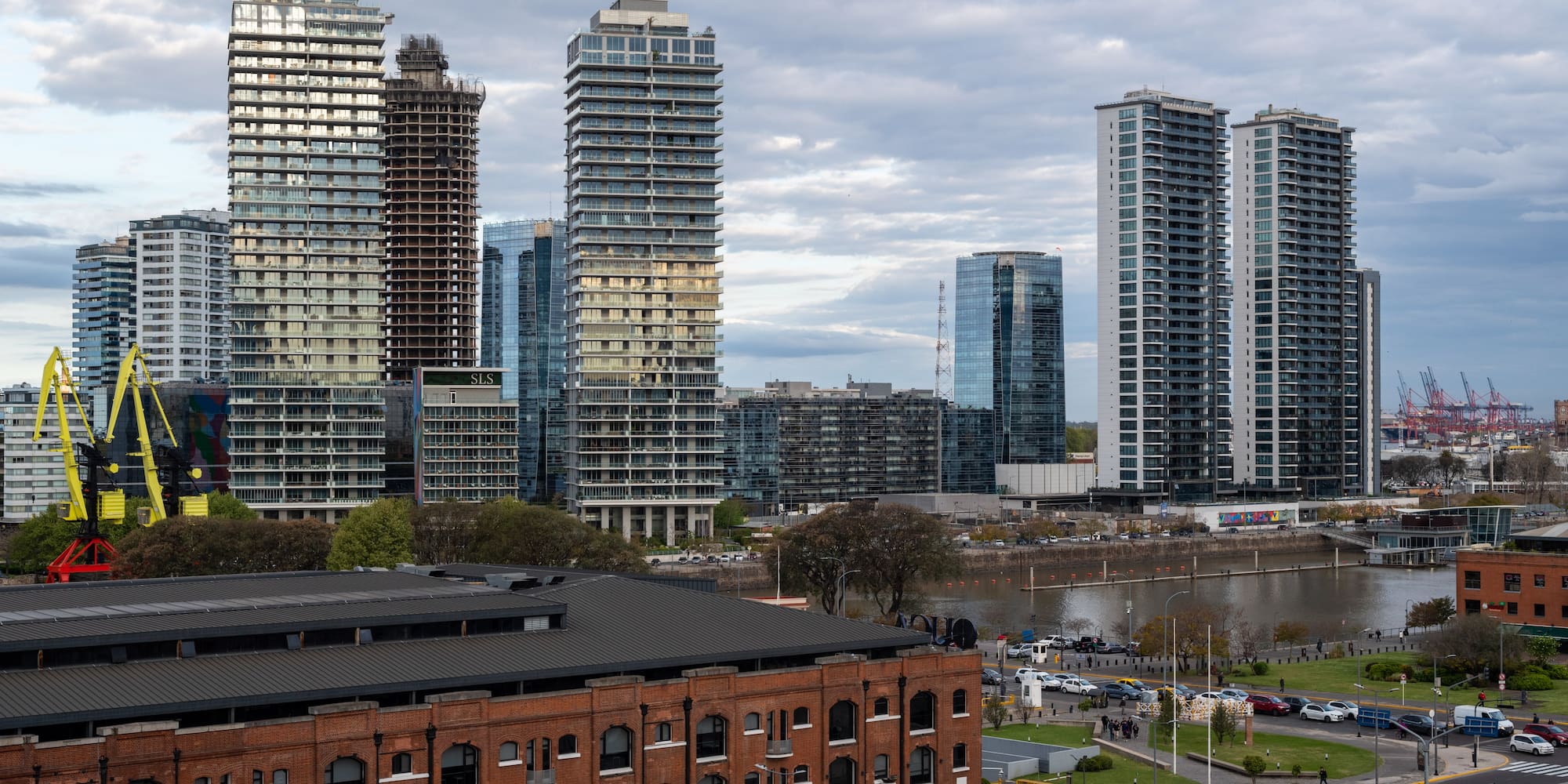 a city with tall buildings and a river