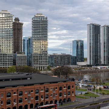 a city with tall buildings and a river