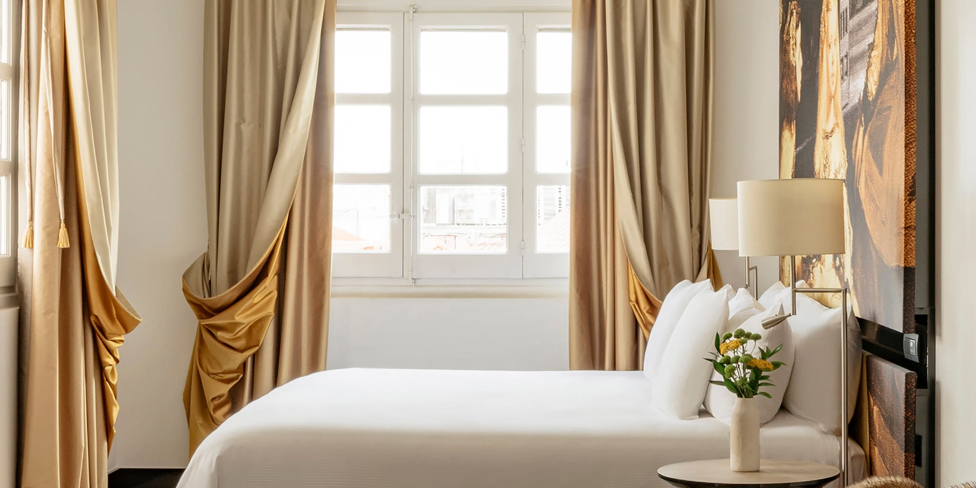 a bedroom with a bed and a table